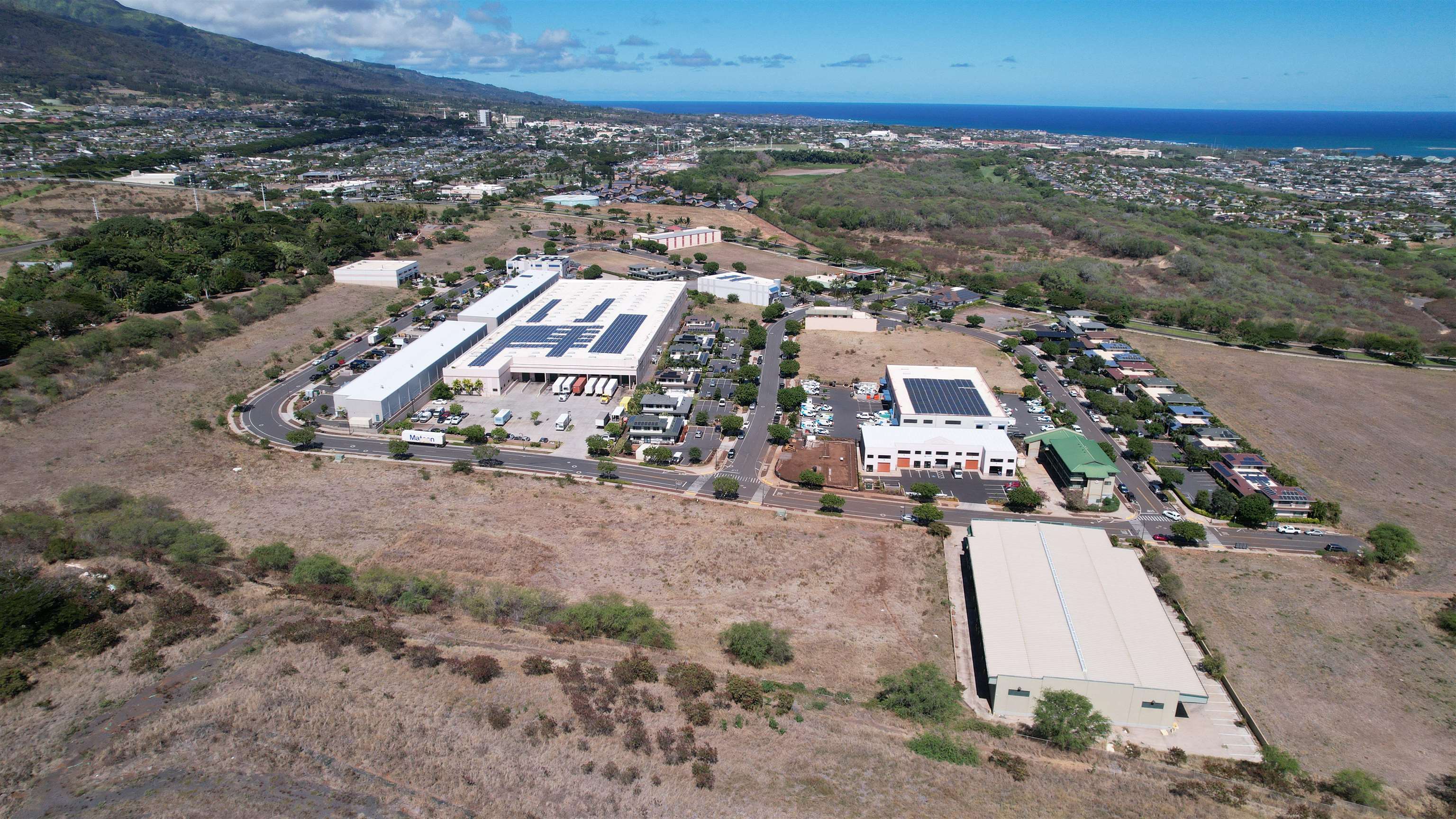 Fee simple vacant land parcel near busy intersection of Kuikahi Drive and Waiale Road.  VMX zoning allows for a wide array of uses.  Ready to build lot with drainage and utilities stubbed to site.
