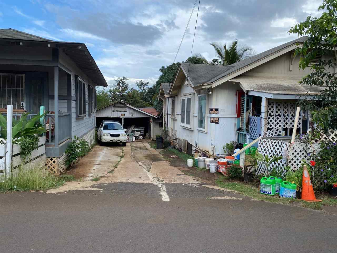 This property is located in the heart of Old Wailuku Town. Built in the 1930'S these plantation style homes are in need of repair and updating. There is also an old carport in the back of the property. 326 Kiele (dark grey) home is a 2 bedroom 1 bath. House  330 Kiele is a 3 bedroom 1 bathroom currently it  has no water meter connection or electricity connection. 330 Kiele will not be shown due to concerns over the structural safety of the home. PLEASE DO NOT DISTURB TENANTS.