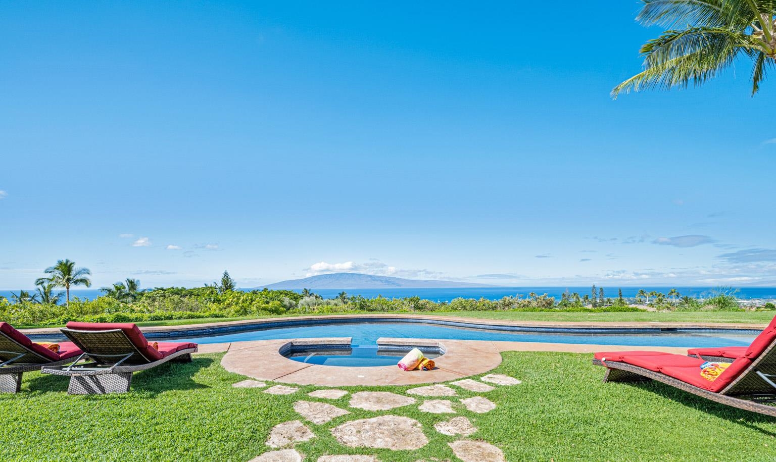 80 Lauawa  Place is a luxurious Maui estate located in Launiupoko. Sitting on 4.16-acres, the estate boasts spectacular views of Molokai, Lanai, and Kahoolawe. This elegant estate includes a 4-bedroom, 5.5-bathroom main villa, and a 1-bedroom, 1-bath detached cottage with its own pool and 2-car garage. In addition, a separate 2,000 Sq. Ft.  barn structure is home to two, 2-car garages providing ample space for cars and recreational equipment.    A Balinese-inspired design boasts a high-beam formal living room, a beautiful kitchen with granite countertops and cherry-wood cabinetry, crown moldings, and pocket sliding glass doors that retract, offering iconic indoor-outdoor Hawaiian-style living.    The perfectly designed outside living space boasts lavish relaxation areas, including the covered lanai with a fully equipped wet bar, a jetted spa, and a beach-style entry swimming pool. Imagine taking in breathtaking sunsets with panoramic views of the Pacific Ocean and the outer islands in the backdrop, enjoying a family barbecue or decompressing by the pool. Snuggle up with a novel under the covered lanai, or lose yourself in time just breathing in the calm ocean air and delighting in the melodic sound of palm trees blowing in the wind.  The grounds include a sustainable farm, with orchards of fresh Hawaiian fruits, including papaya, lilikoi (passion fruit), bananas, and citrus varietals. The air is perfumed by the sweet aroma of plumeria, night-blooming jasmine, and gardenia.  Location wise, the property is conveniently perched above Launiupoko Beach Park, where you can enjoy ocean activities and long days of Maui sunshine. In addition, Lahaina Town and its restaurants, shopping, and nightlife is a short five-minute drive from home.  Hosting spectacular 360-degree views, from the backdrop of the West Maui mountain range to the Pacific Ocean and the outer isles of Lanai, Molokai, and Kahoolawe, you will marvel at the magical Maui sunsets, night after night.   80 Lauawa Place is an exotic, elegant Hawaiian home. Contact us for more information on this stand-out property.  Motivated seller - this property is offered for less than you can build it for today!  80 Lau Awa Place is an exotic, elegant Hawaiian home.  Motivated seller - this property is offered for less than you can build it for today!  Main Home: https://my.matterport.com/show/?m=8Au3rEK3ACk&mls=1  Ohana Tour: https://my.matterport.com/show/?m=dQ32WUyWyKH&mls=1