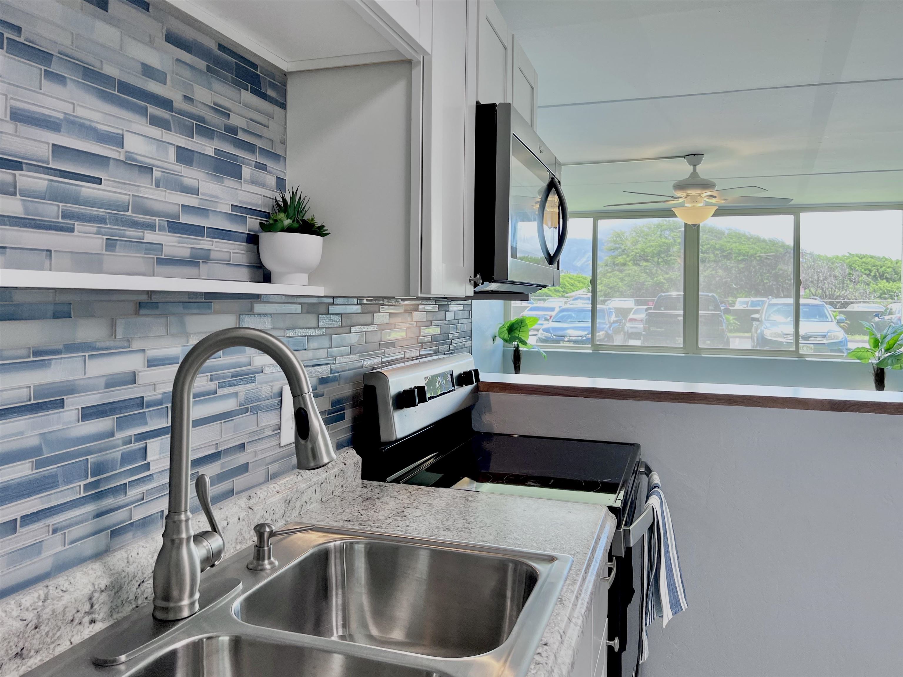 Gorgeous new tiled backsplash and formica countertops.