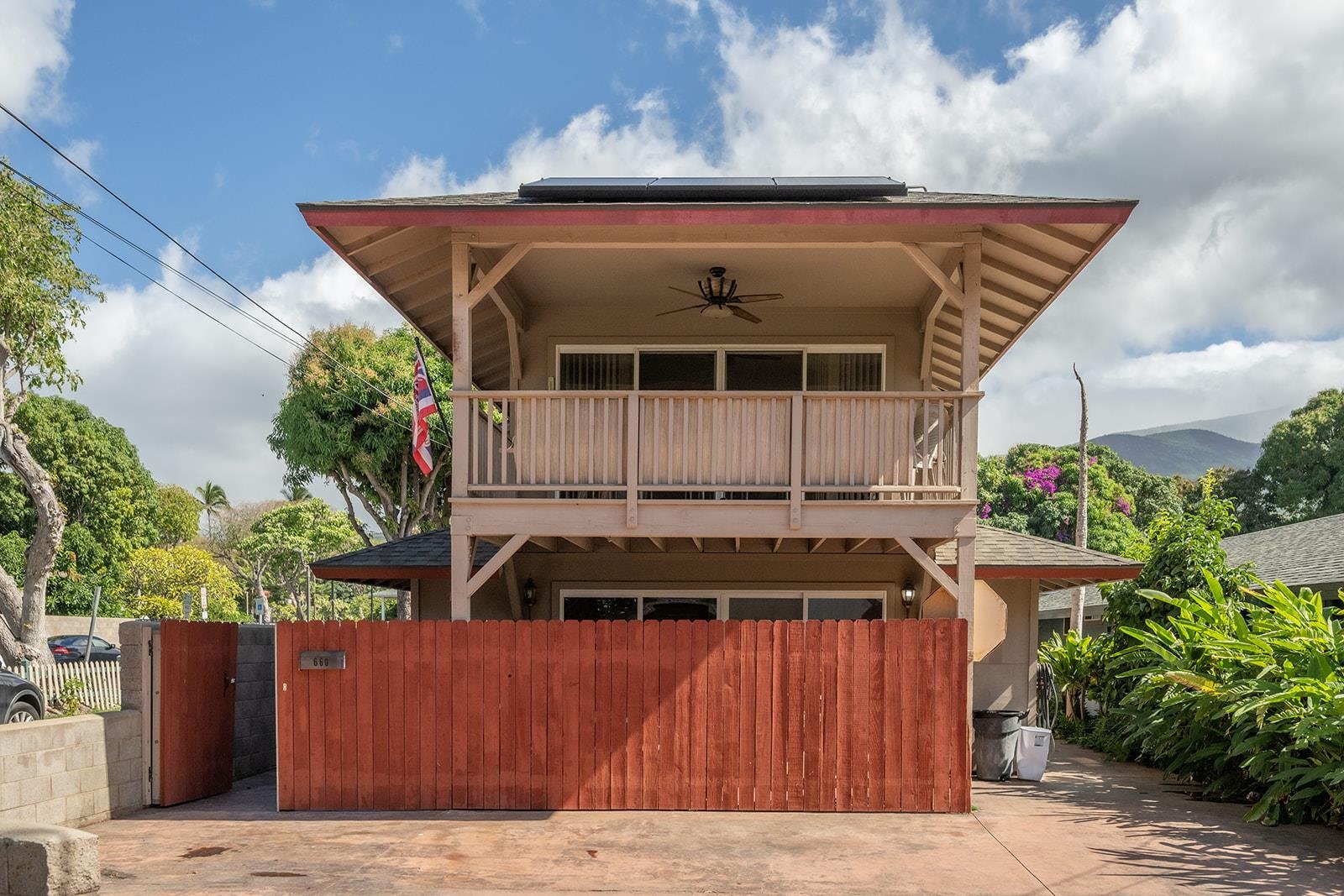Front view of home with two stories and lanai.