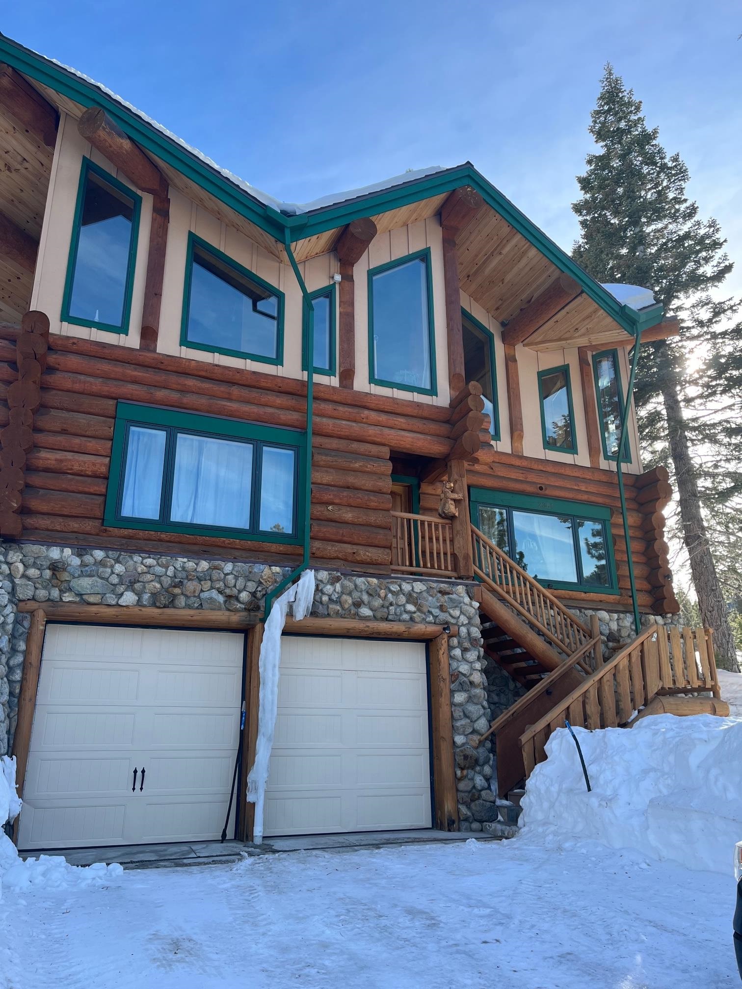 Super cute log cabin!   3 bdrms, 2 shower bath rooms and a full bath in the main house.  Vaulted ceilings, updated kitchen, oversized 2.5 car garage.   Then there is the adorable additional dwelling unit.   Studio loft style!