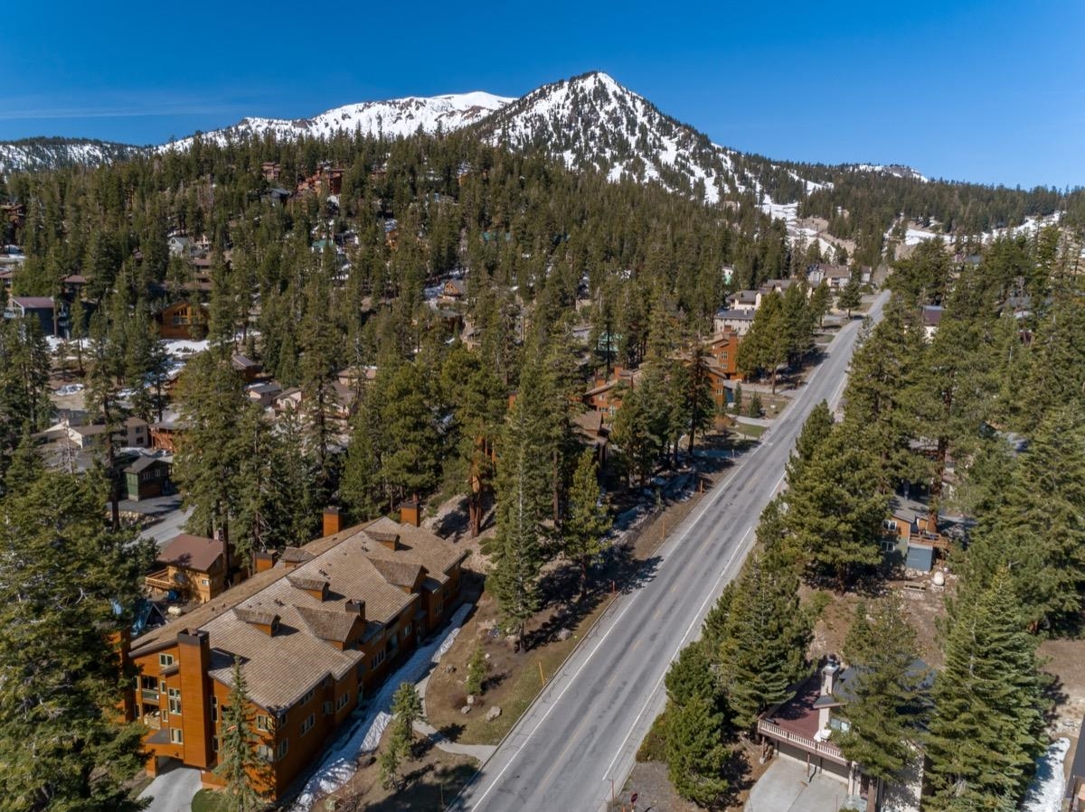 Great location - midway between The Village at Mammoth and Canyon Lodge!     Spacious 2 bedroom/2 bath condo with super views to the Sherwin Mountains.   Most popular floorplan at Mountainback - southfacing corner end unit with island kitchen.     Underground parking makes living in the mountains easy in the winter and cool in the summer.    Shuttle stop is right outside the building for easy access to the slopes.    Sold nicely furnished and turnkey.  Complex has several spas and nice pool for summer fun.
