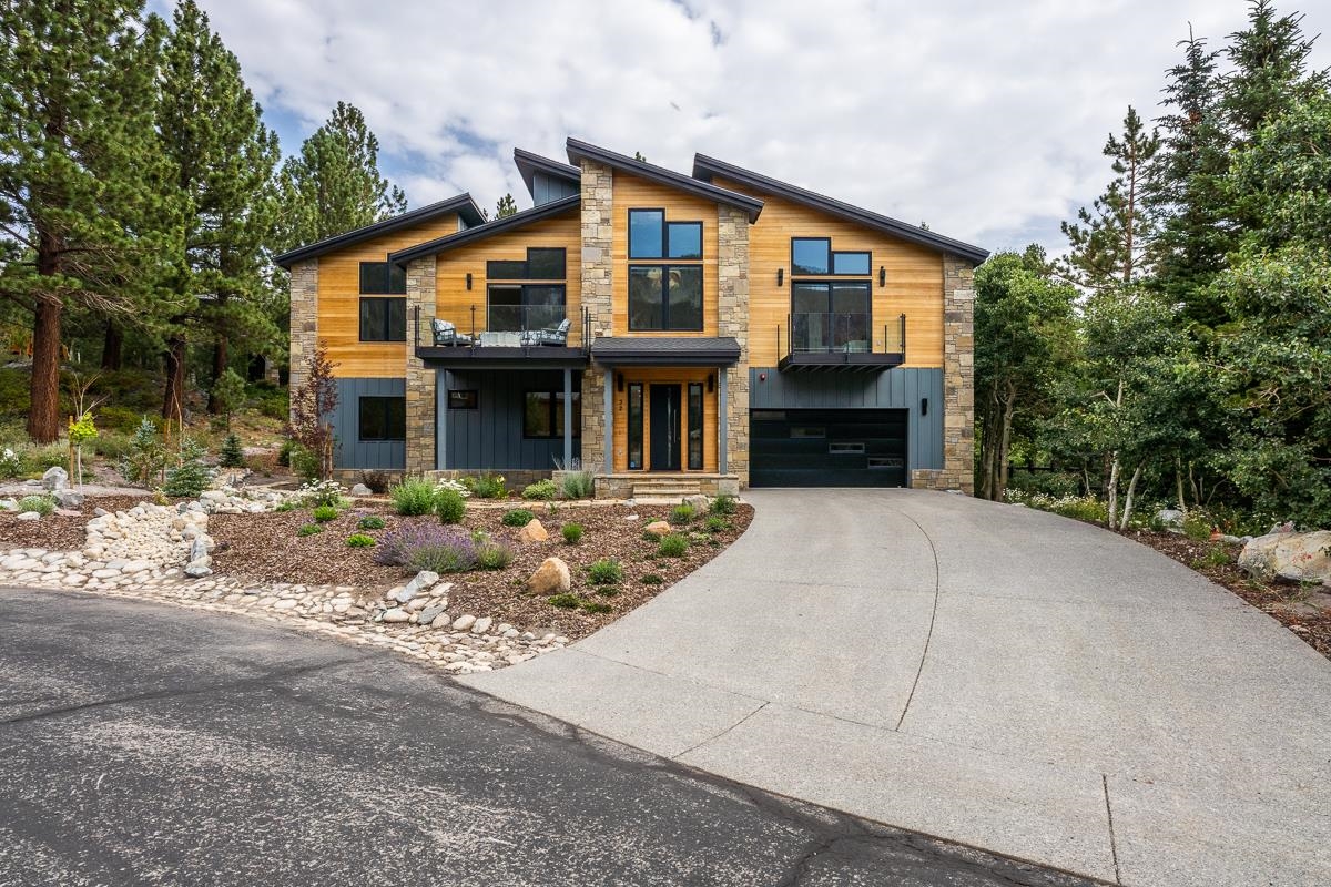 A unique upscale mountain retreat you have been searching for is now available! A spectacular home with full views of the Sherwin Mountain Range. This spacious home rests behind the gate at Snowcreek Fairway Ranch on a quiet cul de sac in Mammoth Lakes. A classic modern home was planned to offer an open airy floor plan designed for both warm family living and social entertaining. Almost every wall is adorned with huge picture windows, showcasing the stunning mountain vistas, which almost feel as if they are a part of the home itself. In addition, there are awe-inspiring photographs by local professional photographer Nolan Nitschke of Sierra Light Gallery, that adorn the open spaces of each room. Upstairs is home to the gorgeous Great Room,  which is accented with details such as a striking stone fireplace, imported lighting fixtures, and a statement bent birch chandelier. The Great Room opens into both the central gourmet kitchen, and large entertainer’s dining room. The kitchen is appointed with all the top of the line appliances a discerning homeowner would want from Wolf appliances to a side-by-side Sub Zero refrigerator. The center island has plenty of seating, and tons of counter space oriented toward the Great Room for casual entertaining. A large upper deck is south facing to take advantage of the stunning views and afternoon sun. Also, upstairs is an expansive, and private Master Suite with incredible 180-degree views of mountains, meadows and forests. There is also a luxurious master bath, his and her closets, and a private deck. Downstairs houses four generous sized secondary bedrooms, each with king sized beds, and three attractive bathrooms. A large media closet, mudroom, laundry room and attached garage, with extra space to store mountain toys, complete the lower floor. This "Smart"home has Nest and Lutron lighting system among other features for easy second homeownership!. A rare opportunity to move right in and begin to enjoy all Mammoth has to offer.