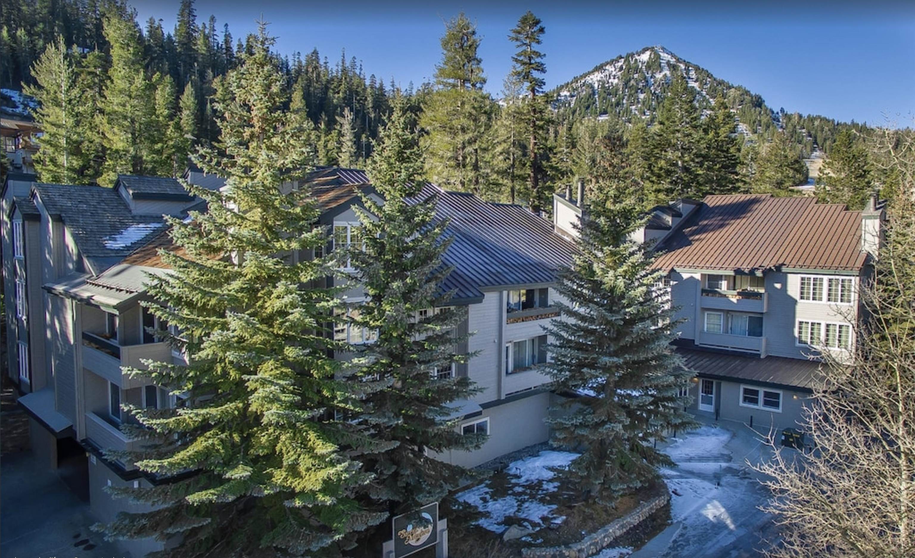 Looking for slope side fun? Convenience, beauty and comfort are yours in this gorgeous, remodeled end-unit condo in Sierra Megeve.  This 1232 sq ft one level condo has 2 spacious bedrooms + bunk alcove, 2 bath and large open living, kitchen, dining area.  This complex is located directly across from Canyon Lodge and is as close to ski-in / ski-out as you will find in Mammoth Lakes – access all Mammoth Mountain has to offer right outside your front door!  From the minute you enter this spacious and open floor plan you are ready to relax.  Right off the stone floor mudroom entry is a guest bedroom, bunk nook and bath.  Step inside the living area and you will find an updated kitchen featuring poured in place concrete countertops with metal trim and custom cabinets.  The large dining room is centered with an art quality light fixture and provides access to the covered balcony. The stone encased wood stove is the focal point of the mountain modern living room with huge sectional couch perfect for relaxing after a day of adventures.  Just off the living room is a large primary suite with dual sink vanity and deep soaking tub and shower.  The living areas and bedrooms feature genuine hardwood floors.  Did we mention storage?  In addition to multiple closets inside the condo, there is a storage closet just outside the front door for convenient ski and board storage.  This condo is move-in ready and is being sold furnished (less artwork).  Enjoy all Sierra Megeve has to offer including underground covered parking, swimming pool, hot tub, sauna and common area laundry.  Besides location, Sierra Megeve is known to be a very quiet and peaceful complex.  The free winter blue line shuttle bus stops right in front and will take you to The Village or to downtown. HOA includes internet, snow removal, exterior and common area building maintenance.