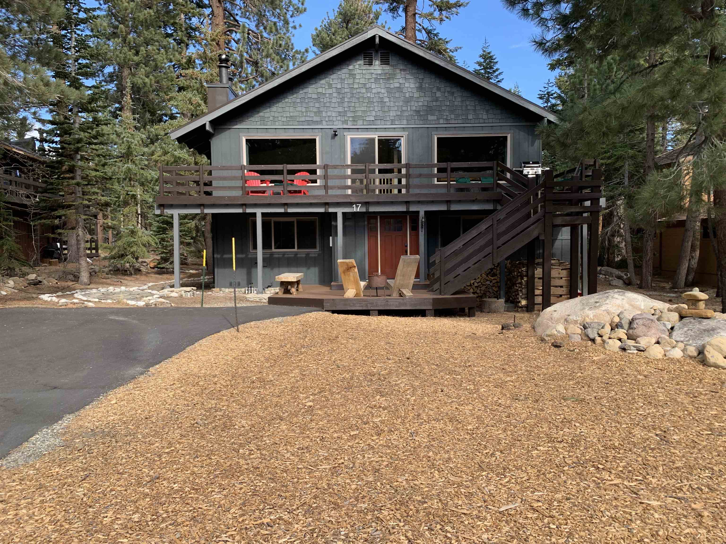 Located in the beautiful Majestic Pines neighborhood near Eagle Lodge - this move-in ready 3 bedroom, 2 bathroom home with a 2 car garage has TWO driveways on a flat lot.  Tons of parking! 5 minute walk to Eagle Lodge or hop on the free ski shuttle (shuttle stop is right next door) and then ski back home through Camp High Sierra. RV parking on East side of home. Trail access from this home is perfect for hiking, mountain biking and trail running. Only a 6 minute drive to the Lakes Basin. First floor has two bedrooms, one bathroom, laundry/utility room and access to the garage. Second floor has the primary bedroom with huge walk in closet with barn door and bathroom, open layout with living room, kitchen and dining, and access to the sunny, south facing Trex deck. Woodstove insert in the living room and brand new pellet stove downstairs, in addition to forced air heating, keeps this home cozy in the winter. New metal roof installed in 2020. South side driveway replaced in 2021. New LVP flooring downstairs and wide plank oak flooring and cork upstairs. Both bathrooms have been remodeled with new cabinets, flooring, sinks, toilets, showers and lighting. All new appliances in the kitchen. New garage doors and openers. New front door and slider door. All new interior solid alder wood doors. All new vinyl windows and many more upgrades. List of upgrades in associated docs. Be sure to check out the Virtual Tour.