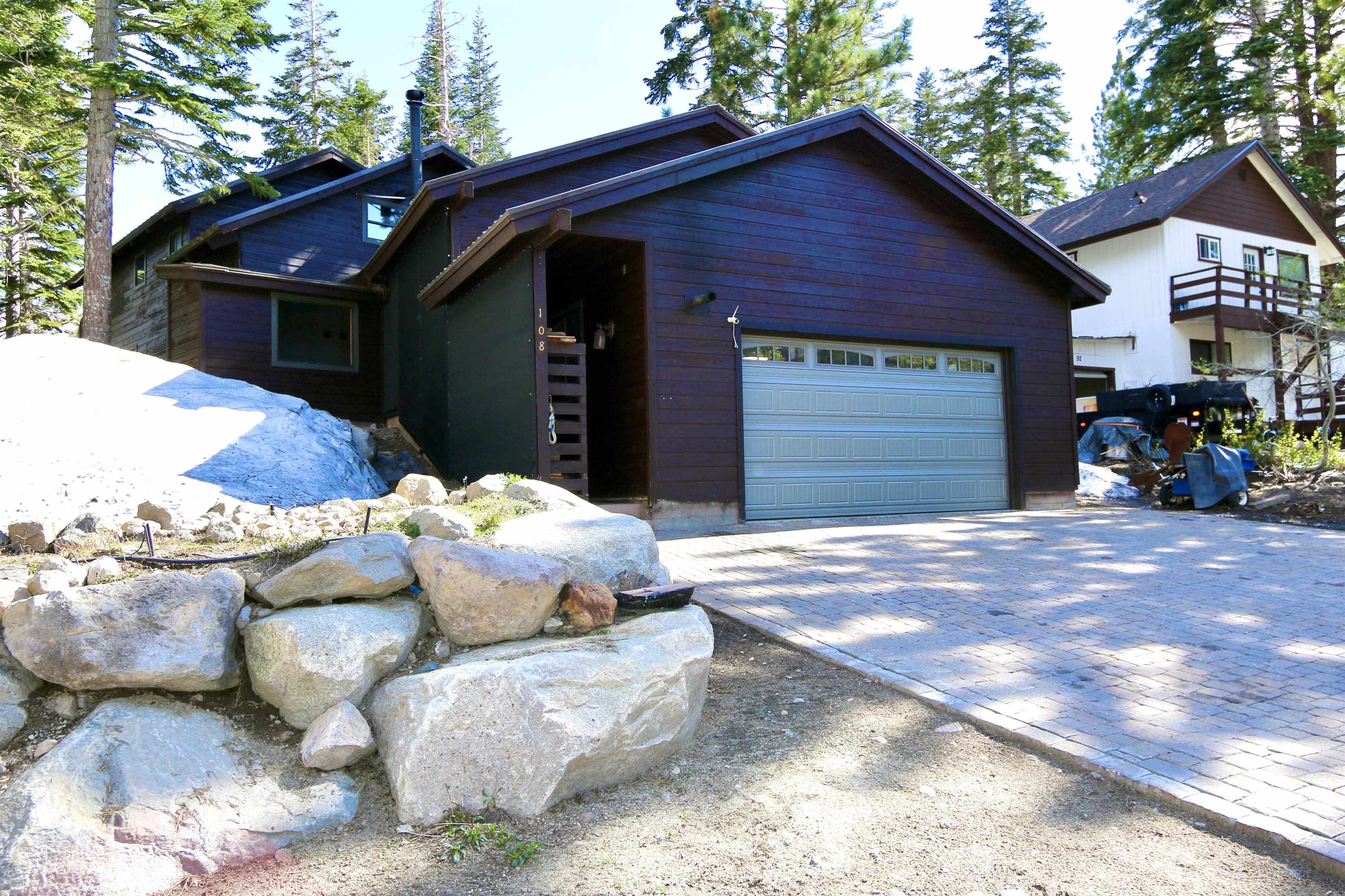 Classic 1969 Mammoth home originally built by Ross Mather. Prime and private Slopes subdivision location with easy access to the Village and Canyon Lodge. Beautiful Sherwin view from great room. Large added-on garage with extra height for vehicle lift or room for living space or ADU. Large utility mudroom serves front door, garage and spacious laundry room. Remodeled kitchen and baths including plenty of stone and concrete countertops. Six-burner commercial cooktop. Wood floors and wood doors. Forced air heat in downstairs, freestanding wood burning stove in great room and pellet stove in garage. Fully fenced yard great for kids, dogs, or?? Metal roof. Large paver driveway. Separate spa shed for privacy. Extra glassed-in storage room with potential greenhouse, work-out room, or?? All hard copper plumbing. This home offers fantastic utility in this mountain environment. Very minor damage through the winter of 2023. Check out the video tour.