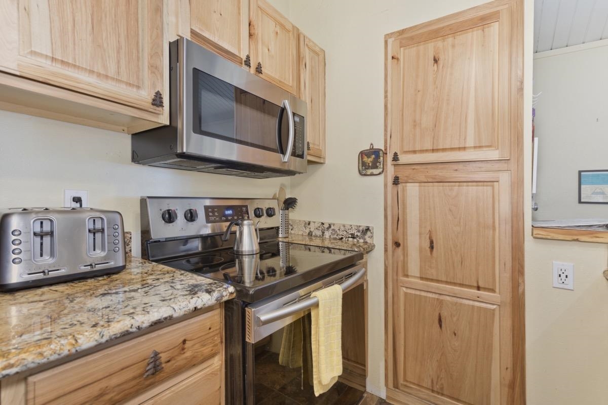 Beautifully remodeled turnkey condo in downtown area one bedroom unit with a loft and two bathrooms.  The kitchen has granite slab counter, newer floors and cabinets.  Freestanding pellet stove in living room, state of the art kitchen with a great entertaining feel.   This condo faces the quiet side of town with partial mountain views. Very easy parking, includes 2 spaces. Walking distance to many restaurants, Vons grocery store, bowling, movie theater, and shopping centers. The shuttle bus stop to the Gondola and lodges is just steps away and only a few minutes ride. Golf, hiking, fishing, and biking trails are also nearby. Sierra Manors has many of its own amenities - an outdoor swimming pool (summer only), 3 enclosed spas, 3 saunas. Per local inspector, stairs and loft meet Town code requirements.