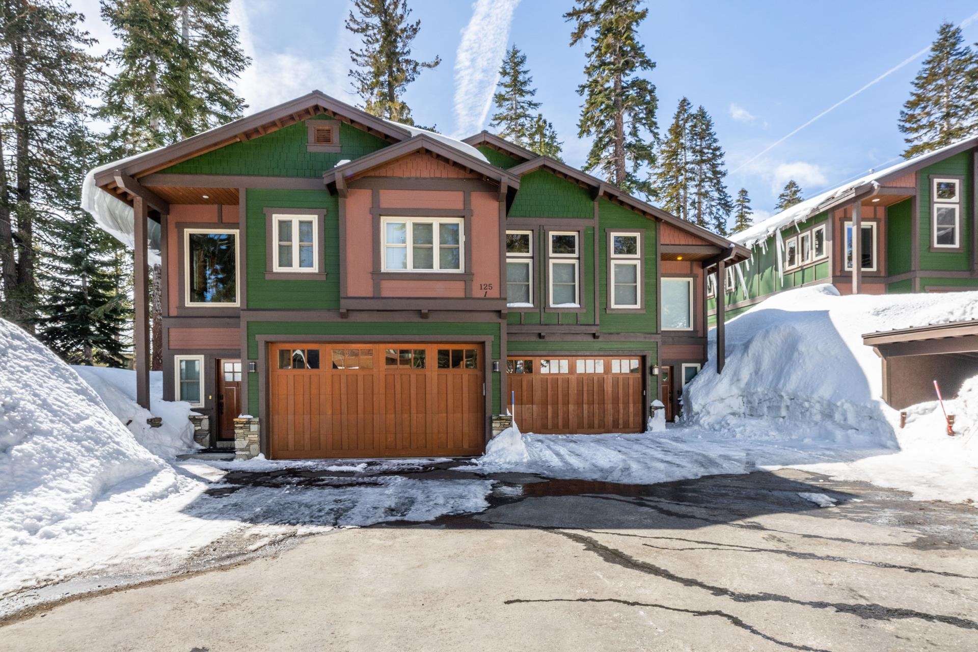 **Spacious, Bright & Just Down the Street from Canyon Lodge!**  This beautifully maintained 4-bedroom + den, 3-bath townhome is the perfect mountain retreat—whether you're looking for a second home or a place to gather with friends and family. With a spacious and comfortable layout, this home features an open-concept living room, kitchen, and dining area filled with natural light, soaring vaulted ceilings, and expansive windows that bring the outdoors in.  Tastefully furnished in a warm craftsman style, the home boasts a large kitchen with granite countertops, stainless steel appliances, beautiful hardwood floors, and a generous pantry. The living room and entry are enhanced by Hunter Douglas Rollerblinds (installed in 2022), adding comfort and style.  Four well-sized bedrooms and a separate den area provide flexible space for two families or multiple guests. Two bedrooms enjoy direct access to private upper and lower decks. The large laundry room adds convenience with extra storage and even a wine fridge!  Enjoy your own oversized 2-car garage and the largest driveway in the complex, offering plenty of extra parking—rare in Mammoth! With only four units in the HOA, this townhome lives more like a standalone home. Out back, you'll appreciate open, southern tree-lined views.  The small 4 unit condo complex allows nightly rentals. The monthly HOA fees are among the lowest in Mammoth for a property this size.   Just minutes to Canyon Lodge, bike trails, and The Village at Mammoth, this is your opportunity to own a high-quality, low-maintenance property with exceptional utility and space—all in a prime Mammoth location.