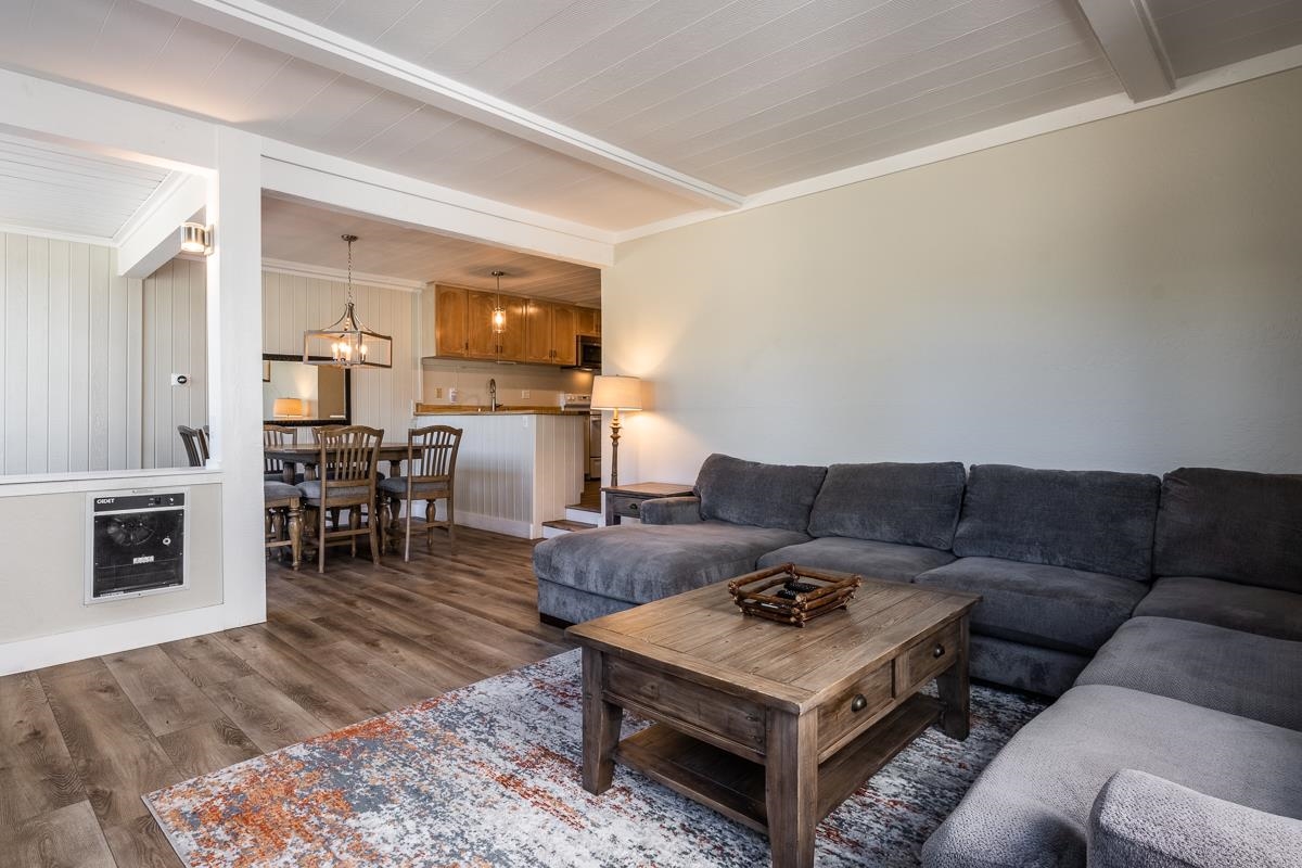 Welcome to your perfect mountain retreat! This spacious 2-bedroom, 2-bathroom end-unit condo is ideally located just steps from Canyon Ski Lodge, offering unbeatable year-round access to skiing and mountain biking. The condo has been upgraded with sleek looking laminate flooring, updated bathrooms, and an EPA compliant fireplace.  With the Village gondola and bus stops just a short walk away, getting around Mammoth couldn’t be easier.  Enjoy beautiful views of Lincoln Mountain right outside your front door. For added convenience, the unit is situated right next to the community amenities, which include a heated pool, sauna, two outdoor hot tubs, game room, laundry facilities, and five "Level 2" EV charging stations. Parking right in front of the unit is also a coveted feature, especially on those powder days.  Whether you’re looking for a full-time residence, vacation getaway, or rental investment, this condo offers the perfect combination of location, amenities, and access to adventure.