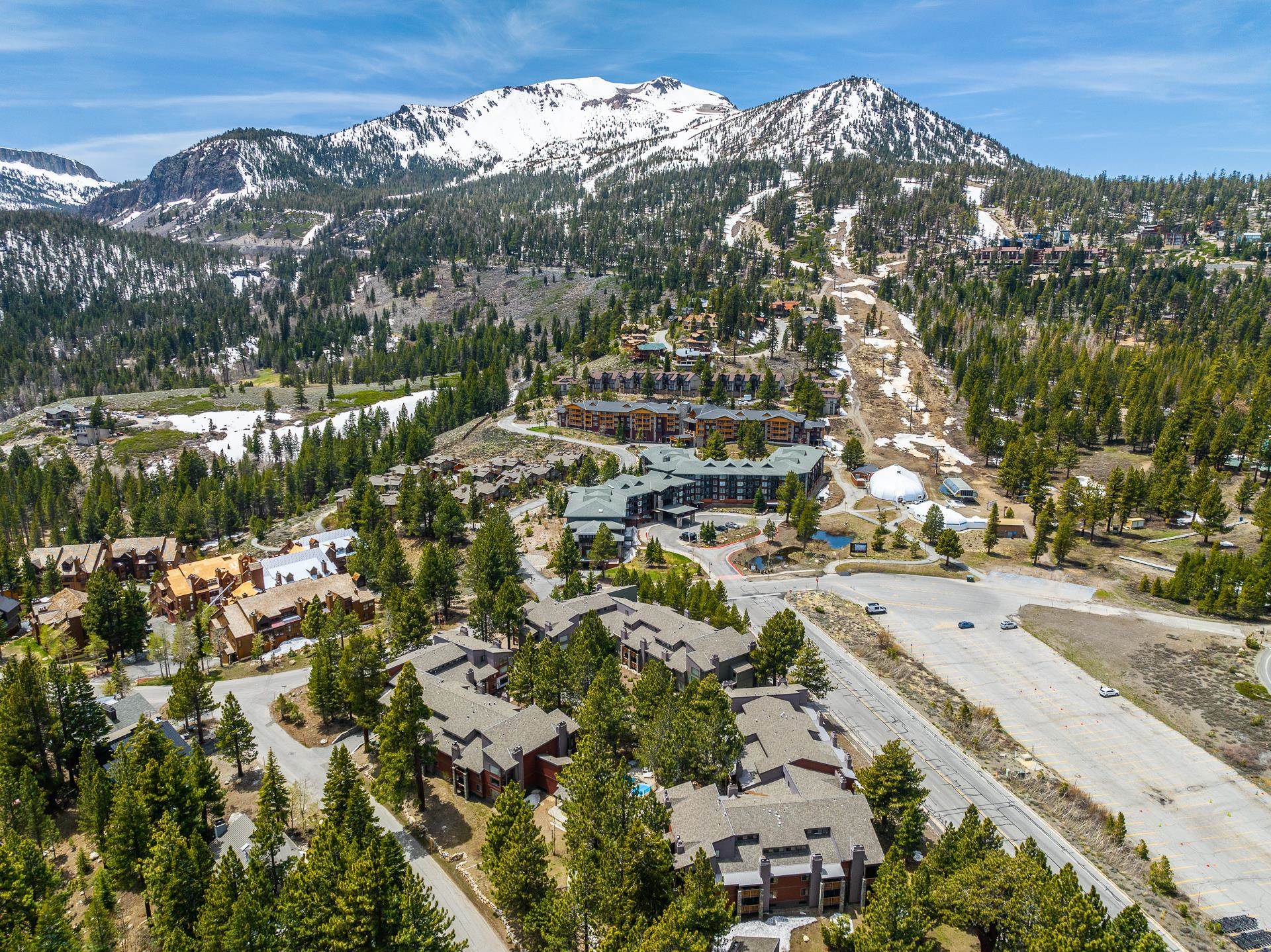 Slopeside at Mammoth Mountain. Situated in the closest building at The Summit to Mammoth Mountain's Eagle Express, literally 100 yards to the lift itself, this exceptional top floor condo offers an ideal blend of comfort and convenience for both relaxation and recreation. With vaulted ceilings that amplify the sense of space, this home feels expansive and inviting. Step inside to discover an open layout that connects the living, dining, and kitchen areas, designed to enjoy relaxed living and entertaining. Whether you're hosting friends or having a night in, this space can adapt to any occasion. Each room is designed to provide a cozy retreat, allowing you to unwind in comfort. The loft/bunk area itself is setup to accommodate every family and guest need which also functions as a great second living area. The complex has an array of amenities...pools, spas, saunas, tennis courts, a gym, and underground parking. The HOA payment covers internet, cable, and hot water making it a great value. Not only does this property offer an unbeatable location next to Mammoth Mountain's Eagle Express, and fantastic amenities to cater to every need, it also presents great rental income potential. Embrace the fun and excitement of the mountains with this fantastic condo as your base where every day feels like a vacation.