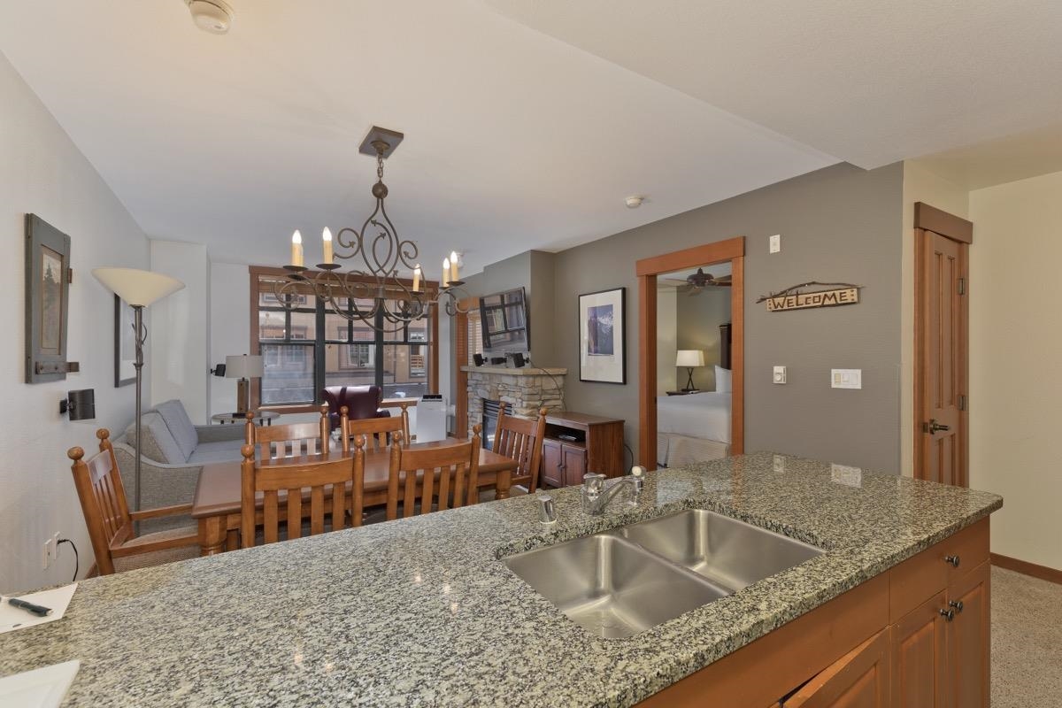 Want a condo in the heart of all that Mammoth has to offer? Then you need to be in the beautiful Village at Mammoth! This 2 bed, 2 bath unit is located near the impressive main entrance and front desk where a concierge and full staff can help  with all of your vacation needs. The Village at Mammoth truly has it all - fitness rooms, a Gondola that takes you straight to the slopes at Canyon Lodge, restaurants and cafes, retail shops, music festivals, underground parking with charging stations, a beautiful pool, and multiple spas. With modern finishes and a lovely balcony, this condo will be a very popular rental for income when you aren't here! Your year-round destination for entertainment and beauty, don't miss out on this beautiful Mammoth condo. Schedule your showing today and take the 3D tour here: https://my.matterport.com/show/?m=Y719MmggBKE&brand=0
