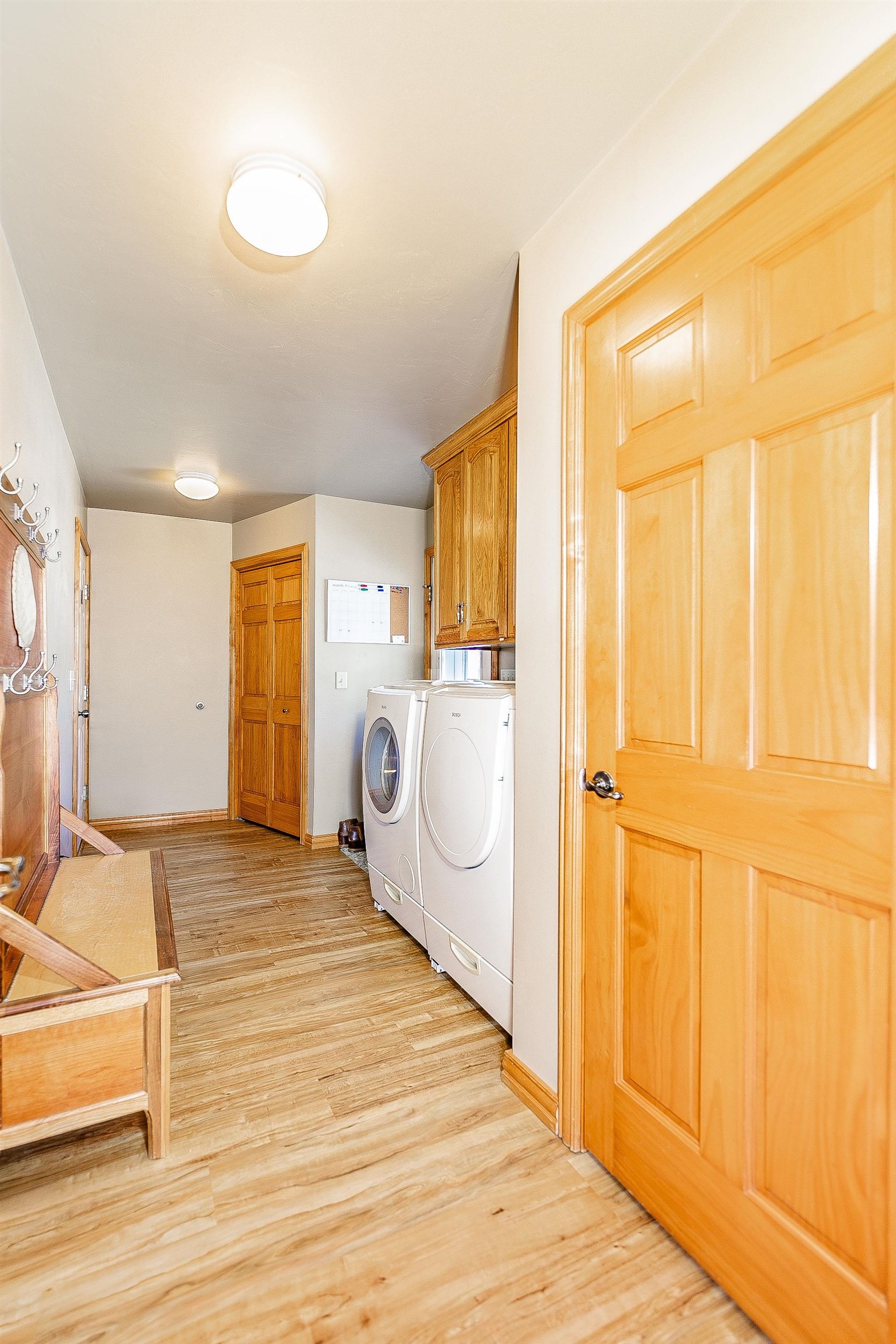 Conveniently located off kitchen between garage/patio with coat closet, locker space & extra pantry!