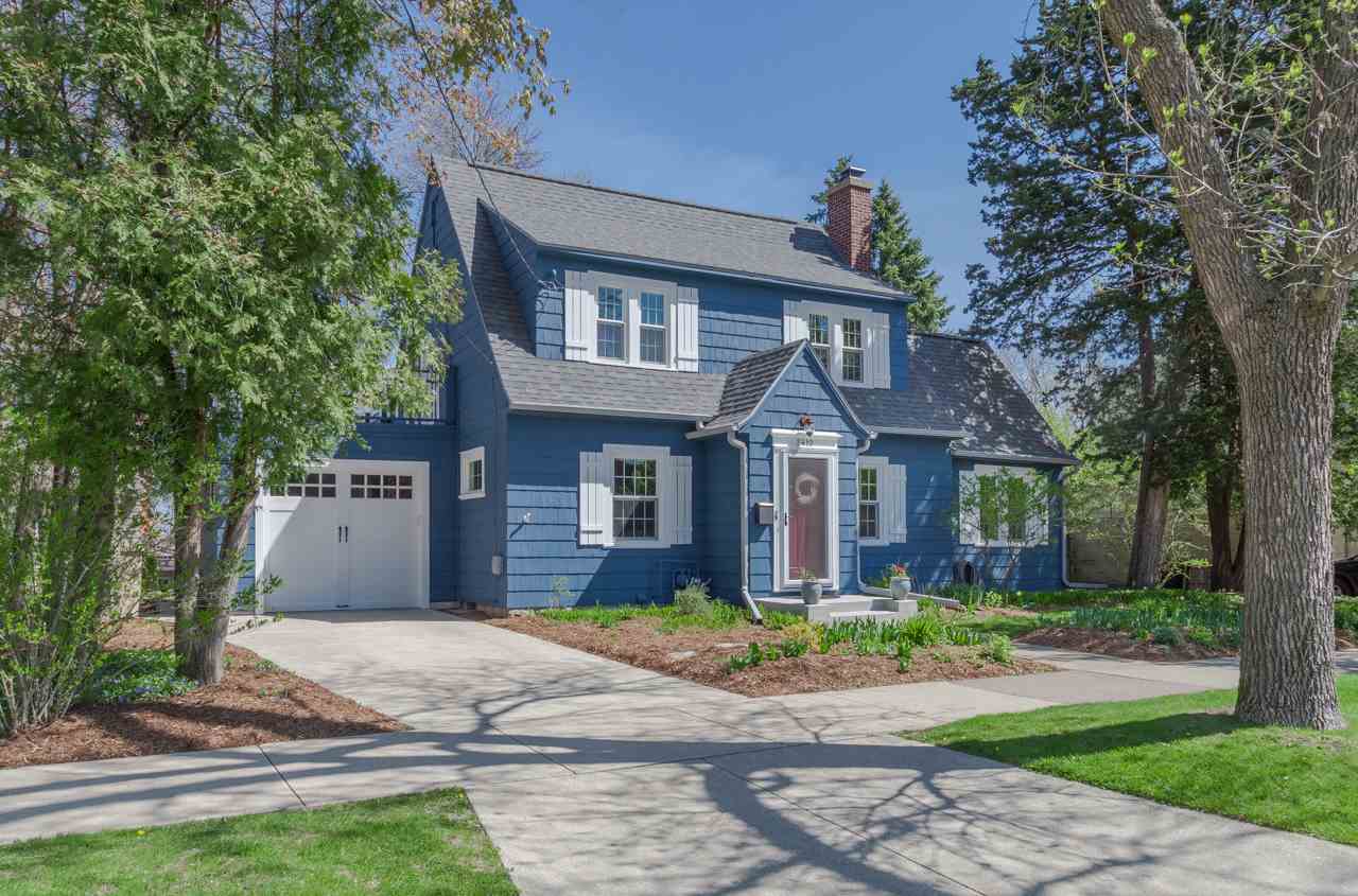 This inviting 1925 Colonial is perfectly located in one of our most desired neighborhoods.  It's within walking distance of great local restaurants, shops, all Monroe St has to offer, West High, UW &VA Hospitals, + Camp Randall. If that weren’t enough, it’s an incredibly lovely place to call home! Original details like arched doorways, built-in bookshelves, gleaming wood floors & hexagonal tiles give the home character+charm while a remodeled kitchen w/stunning cabinetry, a butler’s pantry, and modern amenities make it a pleasure to live in everyday. An inviting living room w/built-ins & a wood burning fireplace share the main level w/ a fantastic sunroom. Enjoy the outdoors on the upper level deck above the attached garage & the brick patio in the beautifully landscaped backyard. Love!