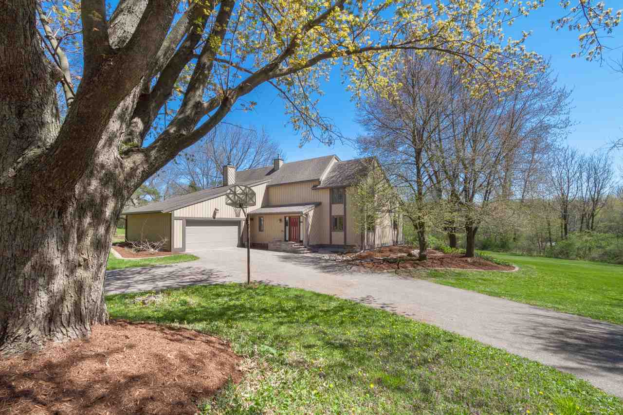 This serene, modern home is perched on a beautifully landscaped acre+ yard on a quiet cul de sac.  Adjacent to a park, this is the perfect escape! The double entry welcomes you in to a 2-story foyer w/floating stairs. A few steps to the left and you're in the updated kitchen & dinette which opens to the family rm w/ its wood burning fireplace. Filled w/natural light, it's the perfect place to entertain. Through the kitchen is the formal dining room with unique chevron wall. A step down and you're in the cozy living room. The main level also has a spacious laundry/mudroom and office. The upper level bedrooms include the master suite with Juliet balcony + walk-in closet + 3 other spacious bedrooms. A ready to finish lower level, plumbed for a bathroom, is ready for your ideas.