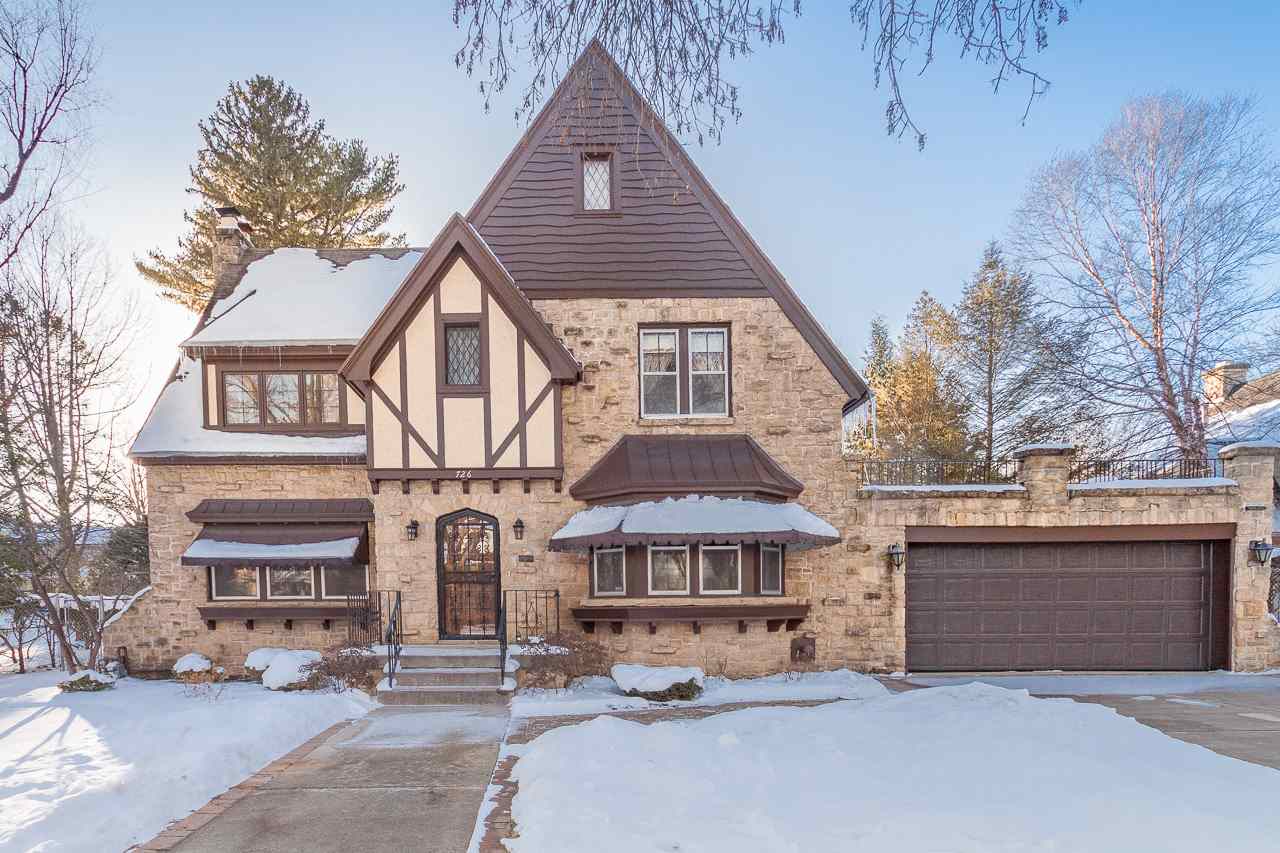 This classic Nakoma Tudor will capture your heart the moment you step inside. From the welcoming entry with its arched window and door + french doors to the interior, to the many lovely and functional built-ins throughout the home, the architectural details make this home one-of-a-kind. The main floor enjoys a fantastic floor plan that allows for formal entertaining in the dining room & living room w/wood burning fireplace, or more casual living in the spectacular sunroom (which would make a great home office) & spacious family room w/access to the screen porch. Upstairs is loaded with charm in its four bedrooms, one with access to the roof deck above the garage. The partially finished lower level with more built-ins offers more space for expansion, as does the attic. Great location, too!