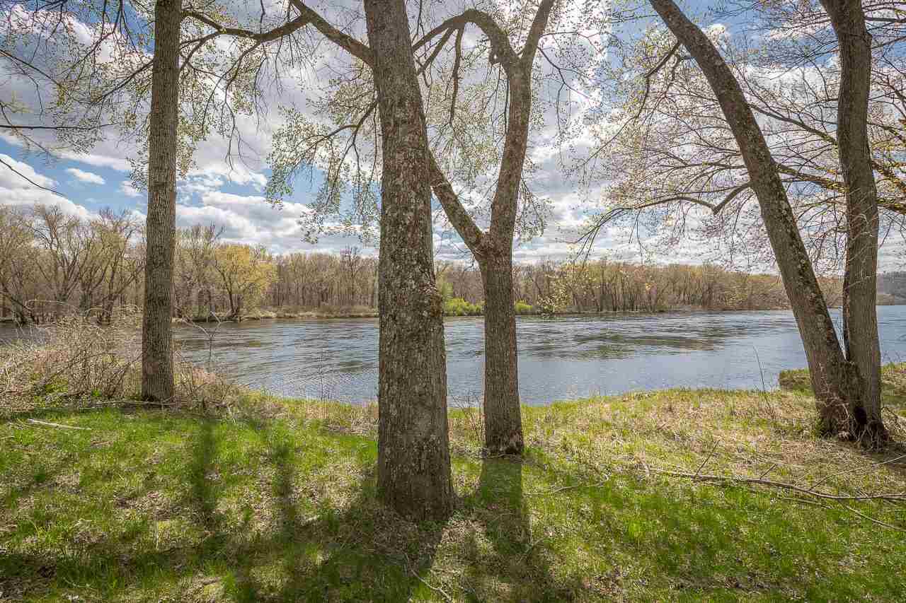 Whether you're looking for a weekend retreat or a year-round residence, there is much to love about this sweet home. To begin with—250' of frontage on the Wisconsin River + 4.25 acres of your very own. It's an outdoor lover's dream (fishing, hiking, hunting, water sports) & a quiet slice of heaven in an amazing location close to American Players Theatre & House On the Rock Resort w/27-hole golf course + spa. If you don't feel like venturing out, there is much to entertain you inside. The spa room features an in-ground cedar hot tub w/rain shower, a 2nd cedar tub perfect for cold plunges, a huge sauna, + a shower wall. It's steps away from a spacious deck w/mechanical awnings. Indoor amenities incl. a gas fireplace, modern kitchen w/great views, vaulted ceilings, large bedrooms & much more.