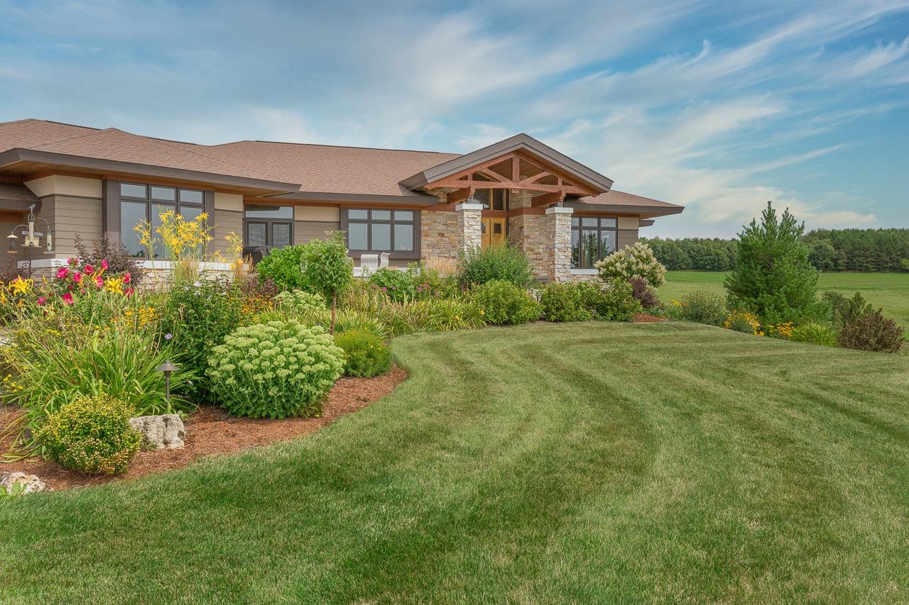 This stunning, custom built ranch offered w/ 6, 118, or 271 acres of rolling farmland celebrates fine craftsmanship at every turn. Natural materials, bright, light-filled spaces & an openness to the outdoors that connects it to the natural beauty of its surroundings including picturesque rock outcropping. From the magnificent entry to the spacious great room w/ its oversized fireplace, the envy-inspiring kitchen w/hickory cabinetry to the walk-out LL rec room w/ a bar + kitchenette, rustic elegance pervades the space creating a serene home with an understated luxury. Enjoy the scenery from the primary suite deck, gorgeous 3-season room, front patio, expansive side patio w/fire pit off the rec room. Main level office & laundry, plus LL studio & huge work room w/hydraulic lift.