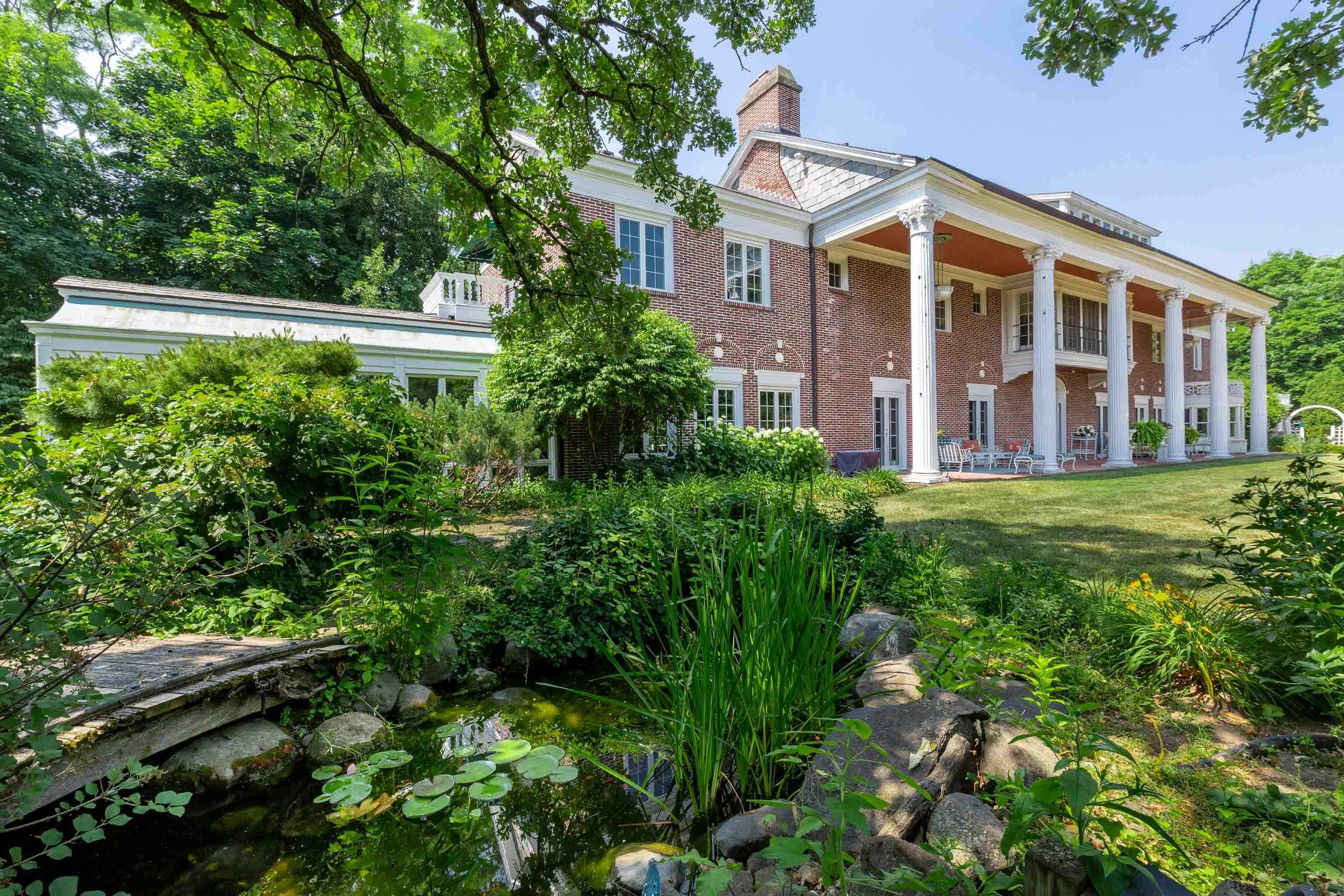 The storied history of this stunning estate named "Edenfred" includes grand parties w/famous guests who enjoyed evenings on the veranda, a dip in the pool, or a formal meal at the 20-person table in the dining rm. Since 1917 it has been a family home, an artist's retreat, & now it awaits its next chapter. A unique find on the west side, the home was built to make the most of natural light & cross breezes. Spacious main level rooms, incl the LR, bar, 3-season rm, dining rm + kitchen have beautiful architectural details & feature an easy indoor-outdoor flow. The 2nd floor highlights incl a sleeping porch & main bdrm w/fp, 2 baths + large dressing rm. plus 3 bdrm ensuites. 3rd floor has lots of fun space too. Not incl in Total SF: 3-seasn pool house w/LR, kitchen, full bath + fp.