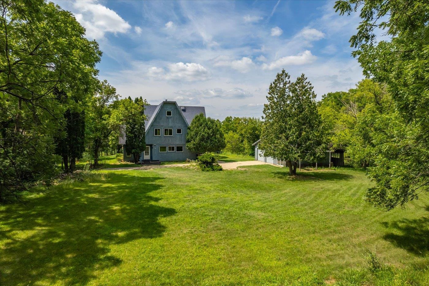 This picturesque Vermont Valley property offers ~49ac of wooded solitude just 30 min from the Capitol.  The land has been thoughtfully managed for high quality timber and has current timber value of ~$315k per recent valuation.  This investment will grow exponentially as the Walnut stands mature in the next 10+/- years. The custom home features  3600+ sqft with 5+ bedrooms, 3 full and 2 half bathrooms or remove the house and build your Dream Home. The lot is exceptional.  The 2 car detached garage has a heated workshop, and the old 'grainery' offers additional storage.    Entirely new mound system was installed in 2022.