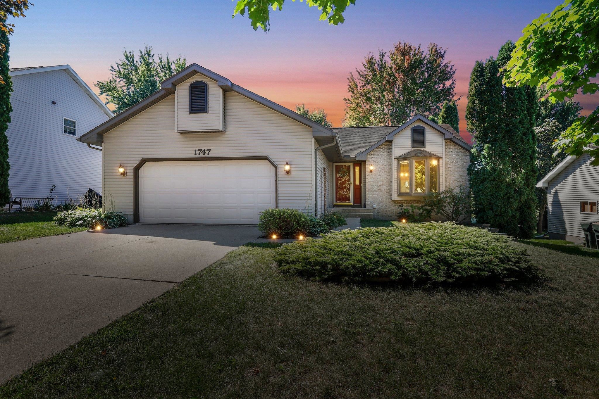 Here it is!  This inviting 3-bed, 3-bath ranch-style gem is on a cul-de-sac in popular Hunters Ridge in Sun Prairie! As you walk in, you’ll immediately notice the vaulted ceilings, a welcoming open floor plan, and an elegant 3-season room that overlooks a beautifully landscaped, fenced-in yard with beautiful mature trees, all perfect for year-round enjoyment. The kitchen connects seamlessly to the dining area and has wood floors that are sure to impress. Your primary bedroom is a private oasis and has an en suite bathroom and plenty of closet space. The basement is impressively large and includes a rec room with a built in custom bar, a den, and another full bathroom.  All this with ample storage as well! This home has all you’ll want in both comfort and practicality. Welcome home!