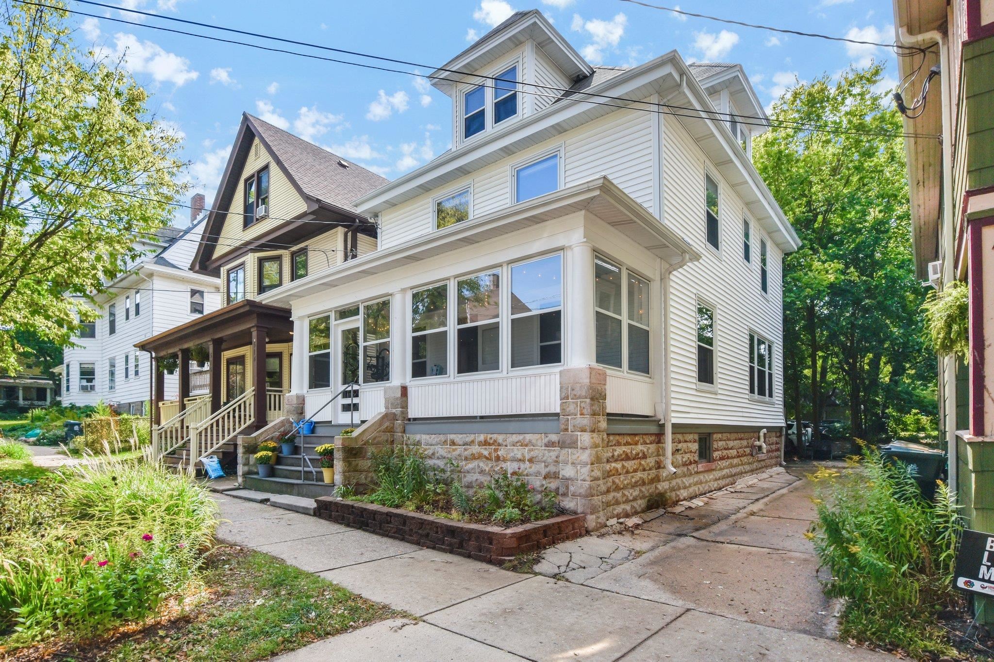 Show 9/22 Marquette Contemporary Victorian is sitting pretty w/extensive updates & an ideal locale next to Orton Park, BB Clark Beach & a short stroll to enjoy Willy St Faire! Classic 3 season porch perched above the St for privacy, perfect for al fresco dining! Architecturally stunning upon entry, original parlor room was opened into the living rm, highlighting the original staircase, woodwork & expansive windows! Remodeled kitchen boasts white cabinetry, SS appliances, breakfast bar & pantry. Spacious dining for gatherings or game night + a main flr 1/2 bath. Four bdrms & a remodeled bath w/heated flrs, built in cabinetry, soaking tub & tiled flr & surround! Walk up attic is ready to finish, plumbed bath & electrical. Covered back porch w/ brick patio & basement access for bike storage!
