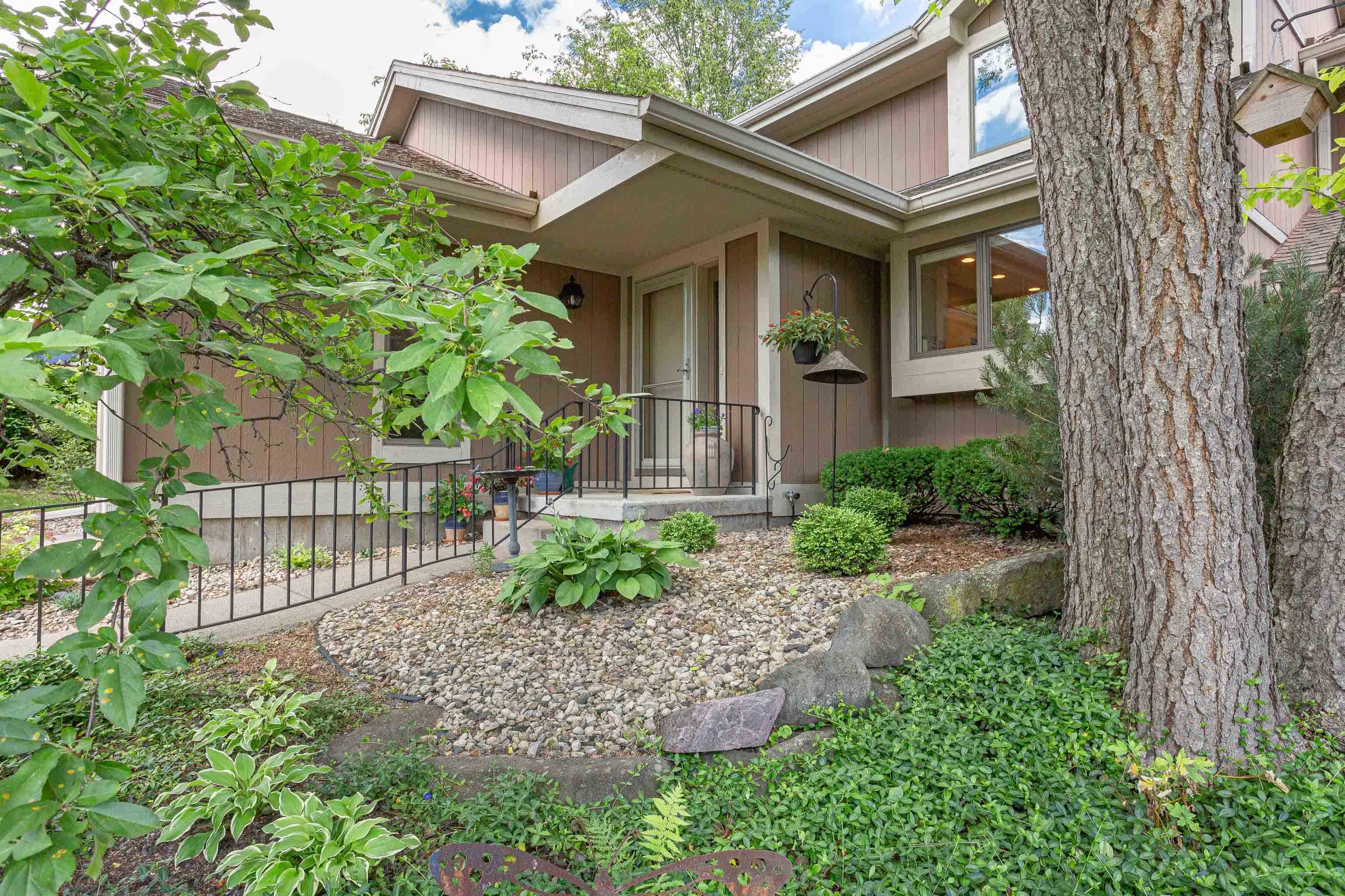 Fantastic Middleton condo adjacent Pheasant Branch Conservancy.  This serene condo is ensconced on a wooded lot & enjoys verdant views. A spacious, light-filled great room wows with vaulted ceilings with skylights, built-ins flanking the fireplace, beautiful wood floors, & glass doors to the private patio. Enjoy entertaining guests in the dining area, or opt for a more casual meal in the eat-in kitchen with plenty of counter space. The main floor also includes the peaceful primary suite with walk-in closet. The lower level has a rec room, a bonus room, & great storage space. Upstairs is the second bedroom & an airy loft for an office or den, or enclose the space for a third bedroom. Great location within walking distance to shops, dining, + walking paths