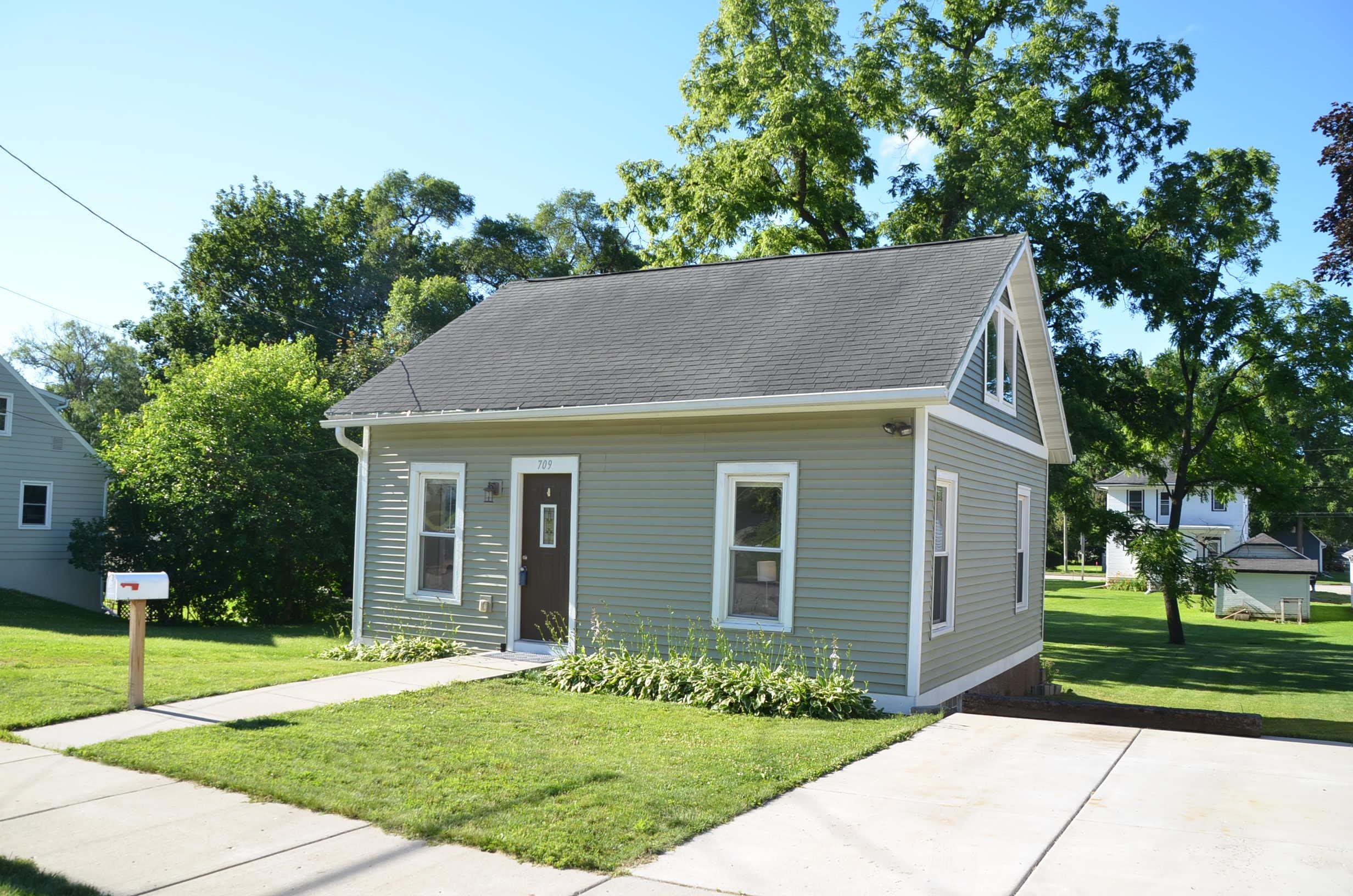Absolutely cute as a button! This darling bungalow home was totally renovated from top to bottom by the current owner in 2015. Every day you will smile as you wake up and enjoy the light, bright and open feel of this mint 2 bedroom charmer. Delightful kitchen for entertaining with friends.  You get to choose whether you want your bedroom on the main level or move upstairs and enjoy a private bedroom just off the loft. The large shady back yard is perfect for your summer gatherings. Plus there is good storage in the unfinished basement with an exit to the back yard. Perfectly located in downtown Stoughton and walking distance to shopping, restaurants and parks. Newer concrete pad for off street parking. Upper level bedroom has no closet.