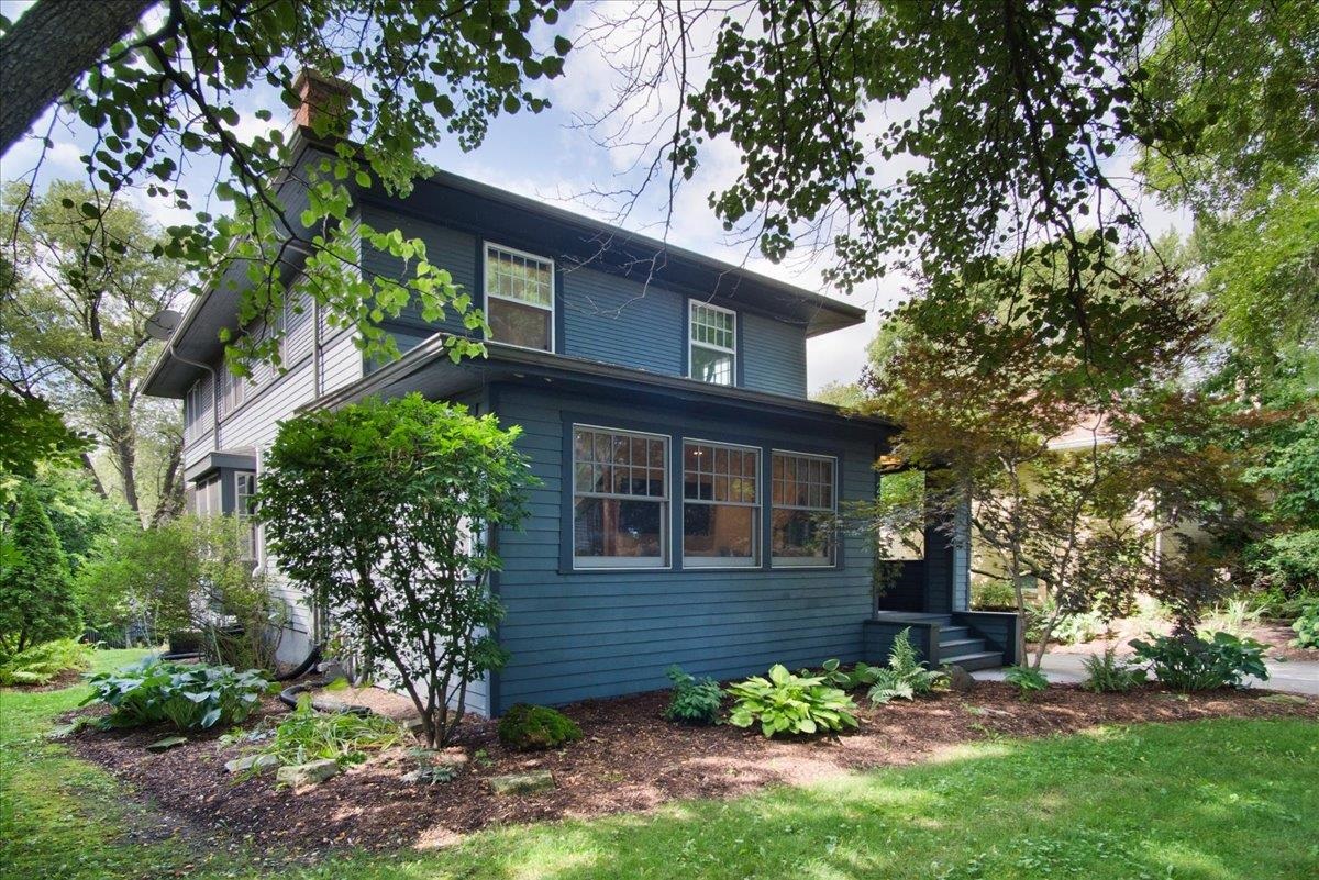 Classic Prairie-Craftsman in the heart of Dudgeon-Monroe. This beautiful home is a perfect blend of excellent updates while maintaining original character. Open floor plan features an amazing architect-designed kitchen w/custom cabinetry, quartz & butcher block countertops, Wolf 6 burner range, double ovens, Miele dishwasher & more!  A welcoming formal living room w/brick fireplace & sidelights is open to the bright family room. Upstairs has a large ensuite bedroom w/walk-in-closet, 3 add'l bedrooms & second full bath. The sunny walk-out LL features an amazing office, rec room, tons of storage & full bathroom. Enjoy every season with inviting landscaped gardens, flagstone patio, deck & screen porch. Move in & be close to everything: restaurant/shops, Lake Wingra, bike path, & UW.