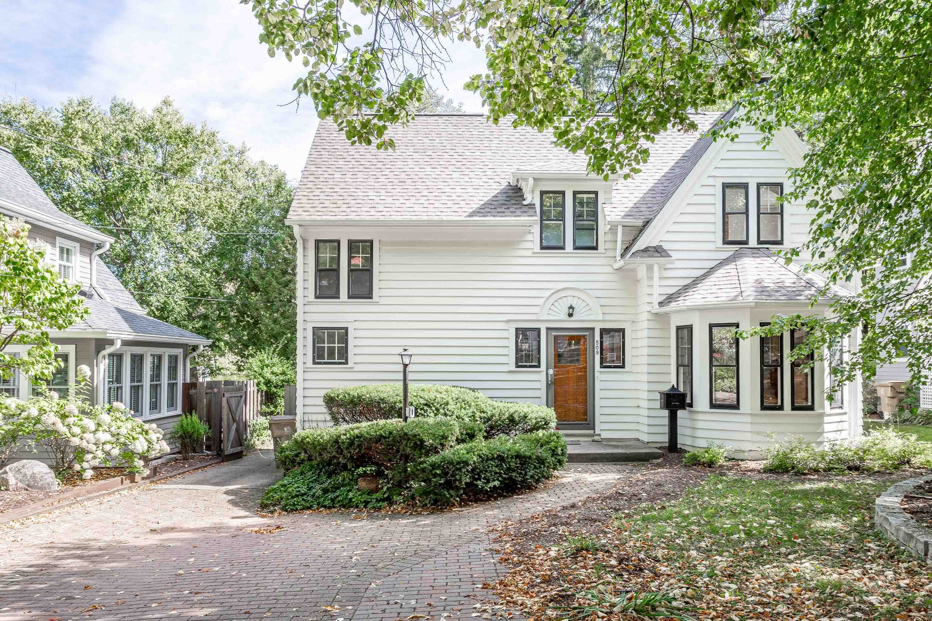 This charming home with classic details sits on a wooded lot on a quiet cul-de-sac in the sought after Regent Street Neighborhood. The main level welcomes you in with beautiful wood floors, a fireplace & lovely bay windows in the living room, a formal dining room, a large, updated kitchen w/wood-burning stove, a sunny mudroom (which would also make a great office), & a 3-season porch. A finished LL offers loads of additional living space. The upper level wows with 3 bedrooms & a gorgeous primary bdrm w/vaulted, beamed ceilings & private deck + a renovated 3rd floor attic space accessed via a spiral staircase & features skylights + built-in shelves. All this in an excellent location close to the bike path, parks, Monroe Street shops + restaurants, schools, UW campus & Lake Wingra.