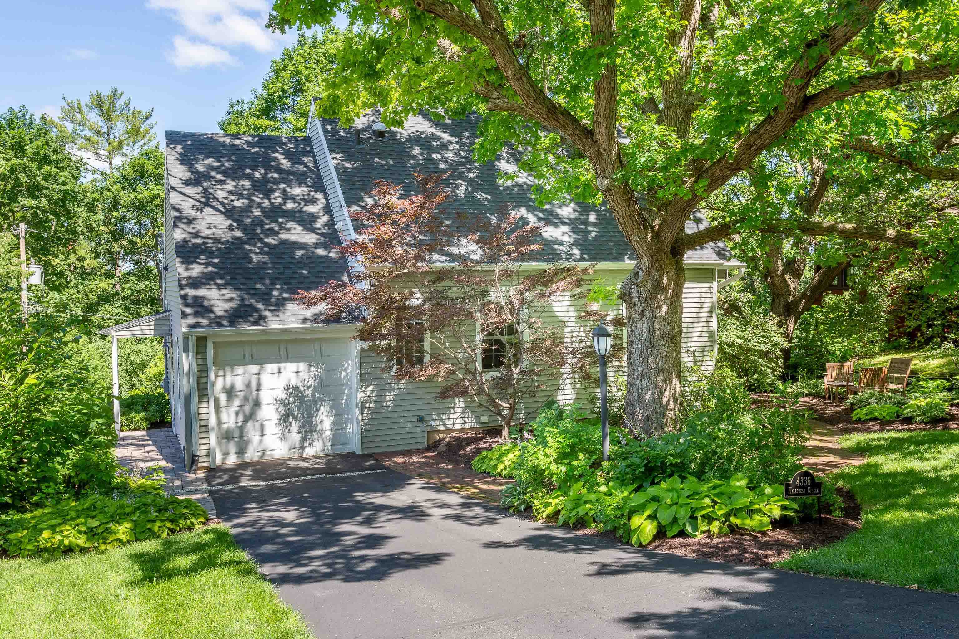 This lovely Sunset Village home exudes historic character & charm with modern amenities after a "to-the-studs" remodel addressing every major component in 2018 (New Roof, Furnace, AC, Water Heater, Water Softener, Electric Panel & Wiring).  Enjoy the updated kitchen & baths, the beautiful paths & stone walls in the private yard. Natural light fills the home on every level making it a warm & inviting space year-round. Relax by the gas fireplace in the living room, entertain in the formal dining room, work or exercise in the LL, enjoy a BBQ with friends on the patio, or retire to the primary suite, reveling in the beauty of high-quality craftsmanship & the comfort of solid construction. On top of that, the location can't be beat - minutes from parks, shopping, dining, hospitals & schools.
