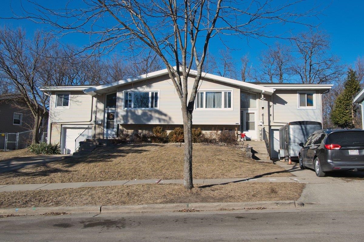 Updated Duplex – Perfect for Owner-Occupant or Investor! This carefully updated split level duplex offers 3 beds / 1 baths per unit with modern upgrades, including new siding, windows, kitchens, and bathrooms. Exposed basements offer additional light filled living spaces.  Each unit has their own private 1 car garage, with off street parking. Nestled on a dead end street near several parks & trails, this property provides a prime location for outdoor lovers. Whether you're looking for an investment or a place to call home with a neighbor subsidizing your mortgage, look no further. With market rents above $1950, this is a must-see.