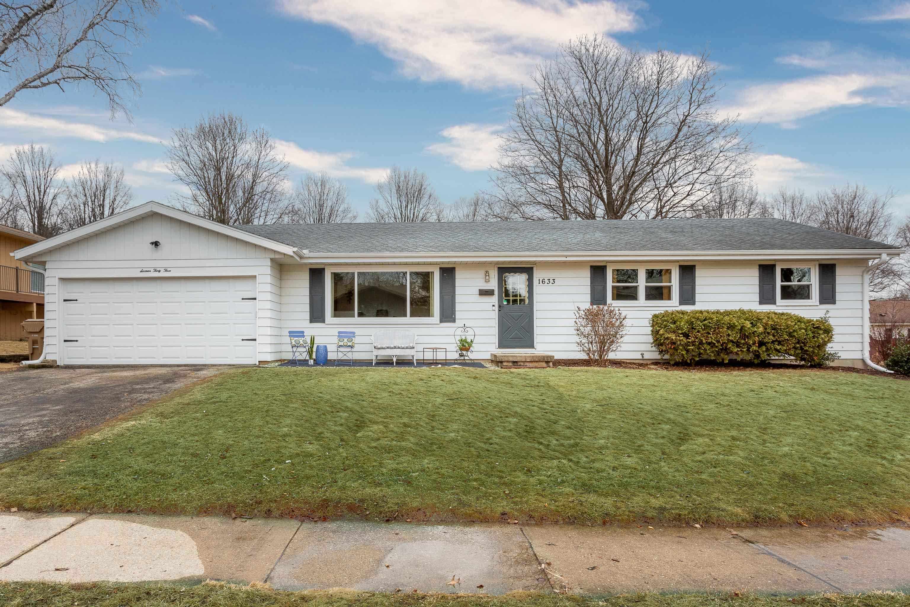 Enjoy easy living in this updated ranch on a great corner lot. There are multiple living spaces for relaxing & entertaining, including the bright & sunny living room, the large family room - with a stone front fireplace - that opens to the eat-in kitchen, & don't miss the spacious rec room in the lower level. The modern, updated kitchen with a breakfast bar is the heart of the home while the three bedrooms, including the primary suite, offer peace & quiet thanks to their location down a separate hall. Spend warm summer nights with friends on the  deck overlooking the back yard & enjoy your morning coffee on the front patio. All this plus this sweet home is in a fantastic location within walking distance to schools, parks, shopping, golf, the library, Lake Monona, & Olbrich park & gardens.