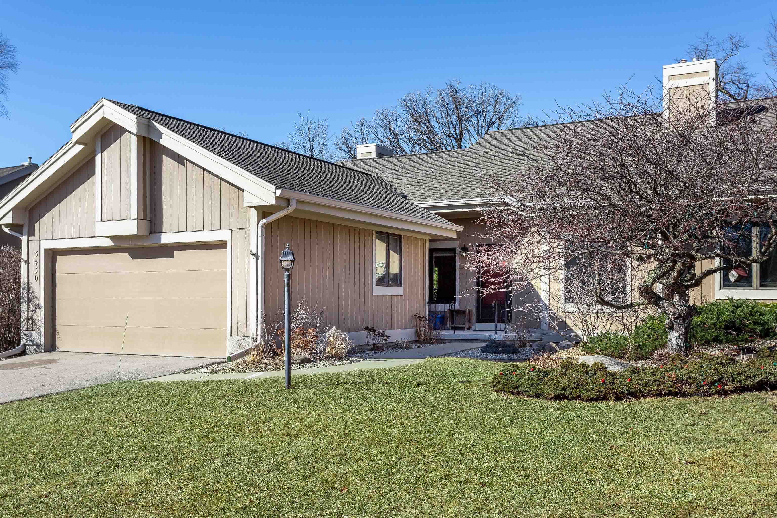 Beautiful Woodcreek condo w/wooded views of Pheasant Branch Conservancy pond + trails. Sip your morning tea on the low-maintenance deck off the great room while enjoying Sandhill cranes, herons, eagles, & songbirds of all kinds. Inside on the main floor you'll find a great floor plan w/a beautifully updated kitchen w/gorgeous cabinetry, a window seat + plenty of room for multiple cooks, a den w/french doors, a sunny great room w/gas fireplace & sliding doors to the deck, a convenient laundry / powder room + the primary suite with a lovely tile shower. The expansive lower level offers a second ensuite bedroom & lots of living or work/hobby space that walks out to the concrete patio. Walk to trails, stores, dining & more & play tennis + pickleball or swim at the Clubhouse. Love!