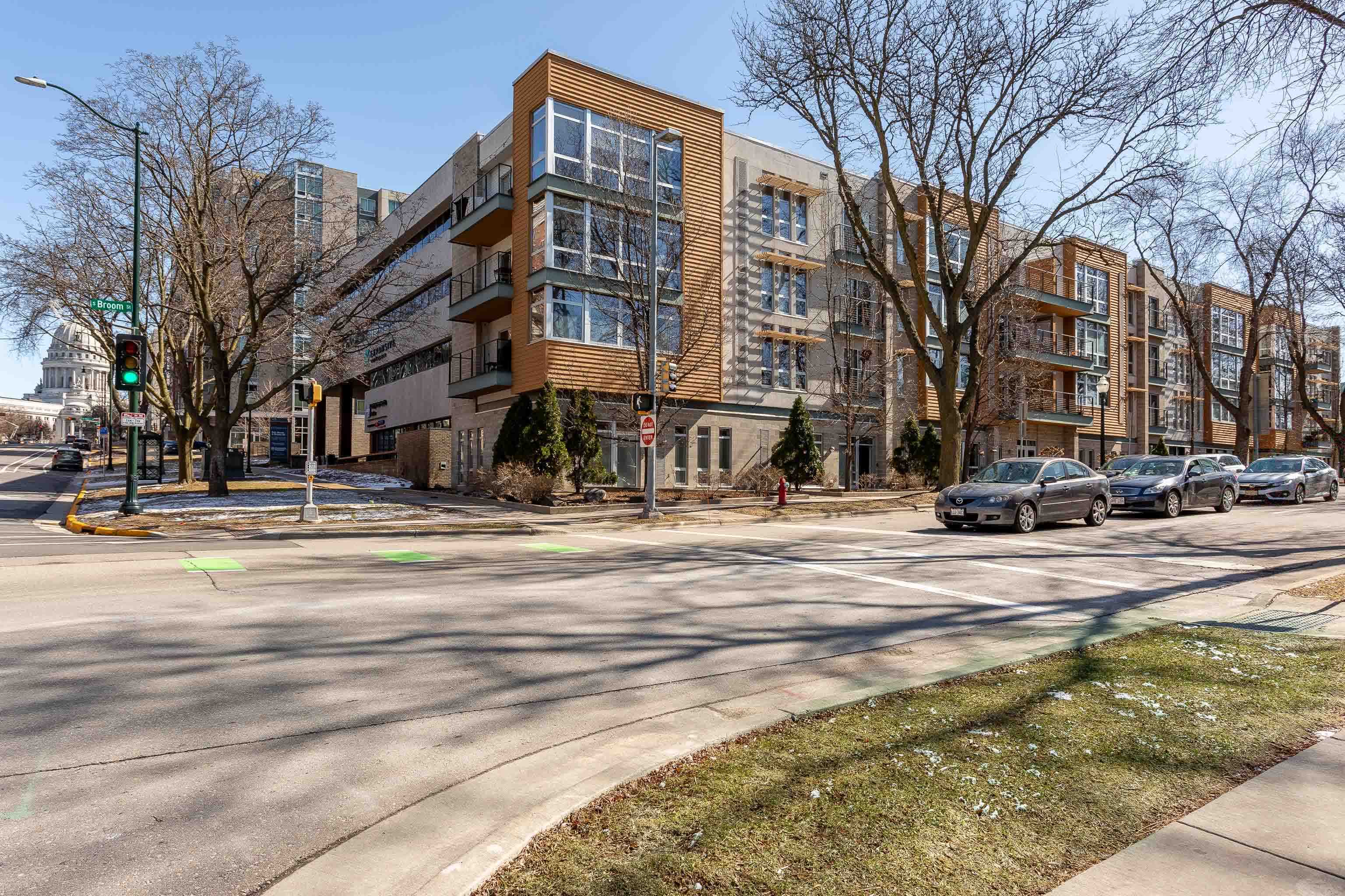 Show 4/4. This sunny + modern condo offers carefree living in the heart of Downtown Madison. This quiet, top-floor unit is located just blocks from the Capitol, you'll have easy access to the lakes, bike paths, parks, & a wide variety of dining & entertainment options, including live music venues, theaters, museums, & the farmer's market.  When you're not out enjoying the town, you'll appreciate the sleek kitchen that opens to a spacious living + dining area w/expansive windows. After dinner, relax on the deck, enjoying the warm summer air. At the end of the day, retreat to the large bedroom, which also features lovely windows. In-unit laundry, a parking spot, and exceptional in-unit storage add to the appeal. This is a fantastic opportunity to truly enjoy all that Madison has to offer!