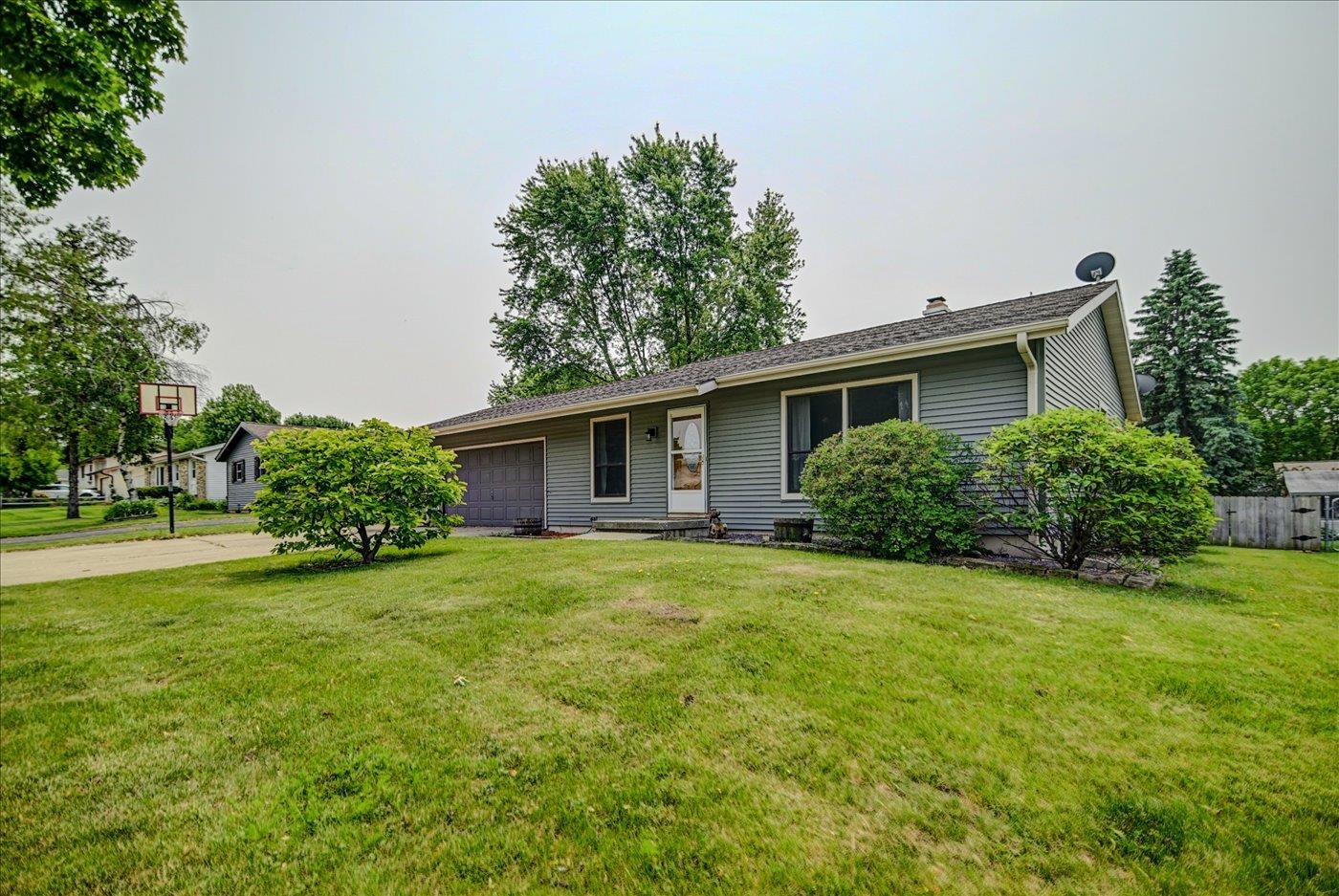 This charming east side 3 bedroom, 2 bath ranch with space to relax, play, & grow! Enjoy sunny mornings in the bright living room, host game nights in the oversized lower-level rec room with a wet bar & full bath, or unwind in the fully fenced backyard - perfect for gardening, bonfires, & summer evenings on the deck. The updated eat-in kitchen features generous cabinet space & a pantry for all your gadgets. The finished lower level offers plenty of hangout space plus tons of built-in storage. Set on a level lot with an attached 2-car garage, this home is tucked into a convenient location near parks, shopping, restaurants, & bus lines. A great layout and even better vibes - come see for yourself!