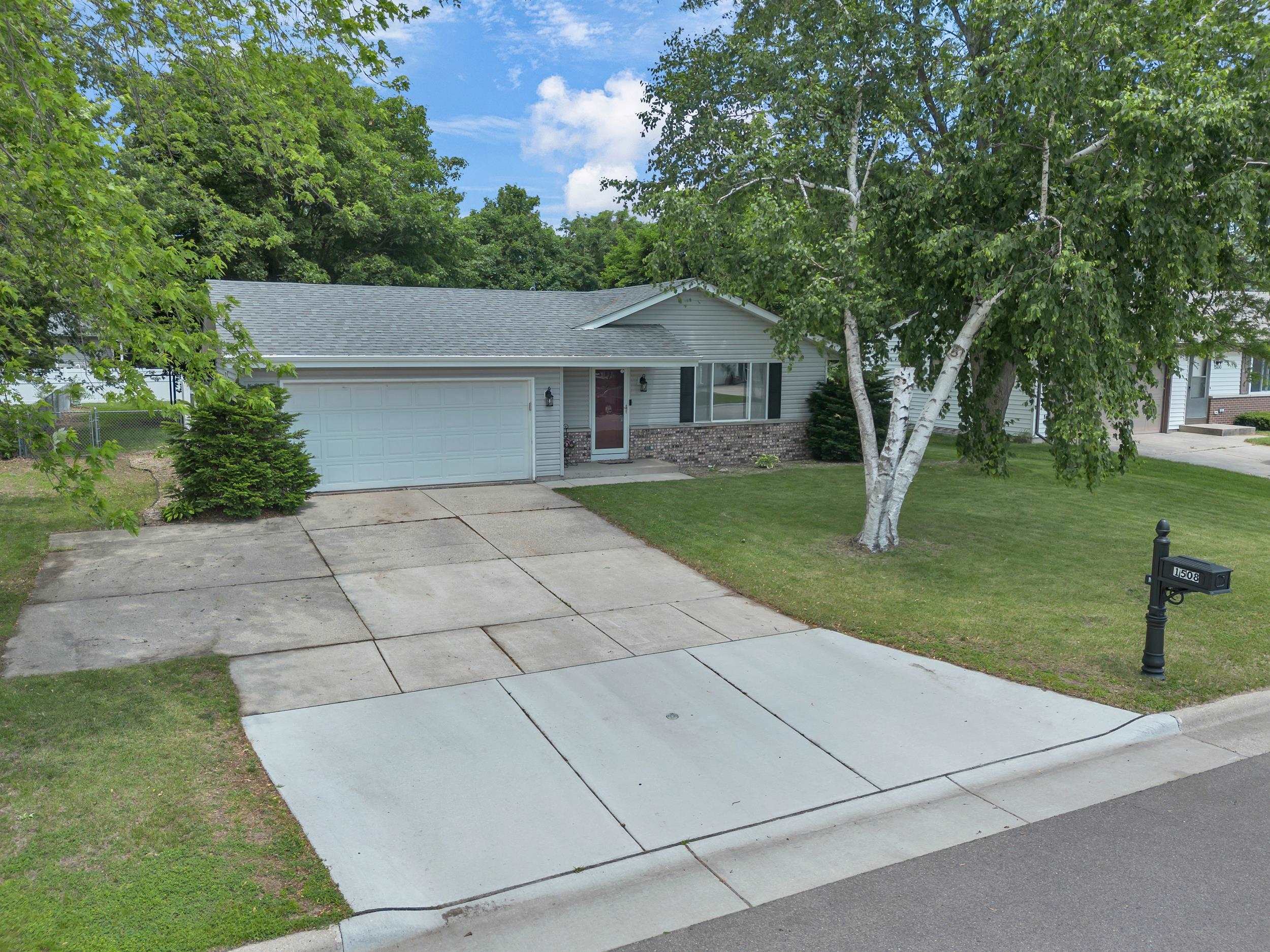Lovely 3 bedroom, 3 bathroom Ranch home on a nice quiet street. No sidewalks to shovel! Terrific floor plan offers a foyer that does not require you to walk through the living room to get to the kitchen. Kitchen is big and bright & has plenty of room to add island with seating that you've always wanted. Kitchen appliances included. Beautiful quartz countertops in kitchen & bathrooms. Recently remodeled main bathroom has tiled oversized bathtub area. Dining room w/lots of room for a good sized table & patio doors going out to concrete patio. King size Master bedroom suite offers a private full bath. The LL provides approx. 1,200 sqft of dry basement giving you a large family room, bar area, office & 1/2 bath. 2 car garage is insulated & sheetrocked. Big backyard is fenced. Lots of extras!