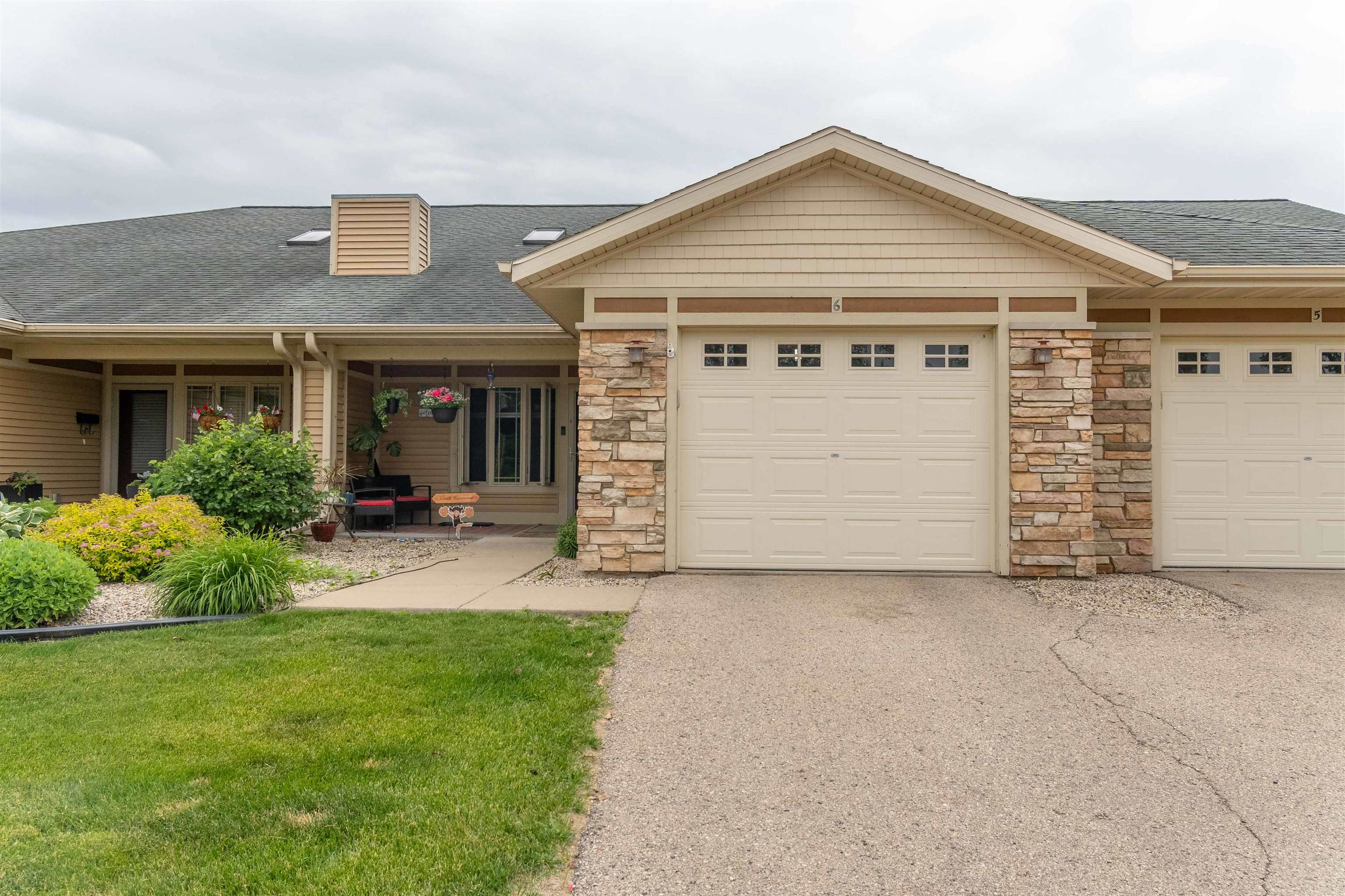 Beautiful condo located in a very beautiful location just a stone's throw from the Wisconsin River & several parks! Lovely open floor plan is inviting w/lots of space for entertaining in style. Cathedral ceiling & skylight accentuate the large living room. Fresh kitchen w/cherry cabinetry, pantry & appliances included. Lots of counter space, spacious breakfast bar & 2 bar stools included. Lovely south-facing covered, screened back patio gets awesome afternoon sun! King size Master bedroom suite has vaulted ceiling w/spacious private, full bathroom & double closets. Main level laundry room w/included washer/dryer. Interior was freshly painted in 2024. New roof & skylights! Finishing this basement will add approx. 1,200 sq ft w/potential for 3rd bedroom & bathroom. Pretty & private backyard.