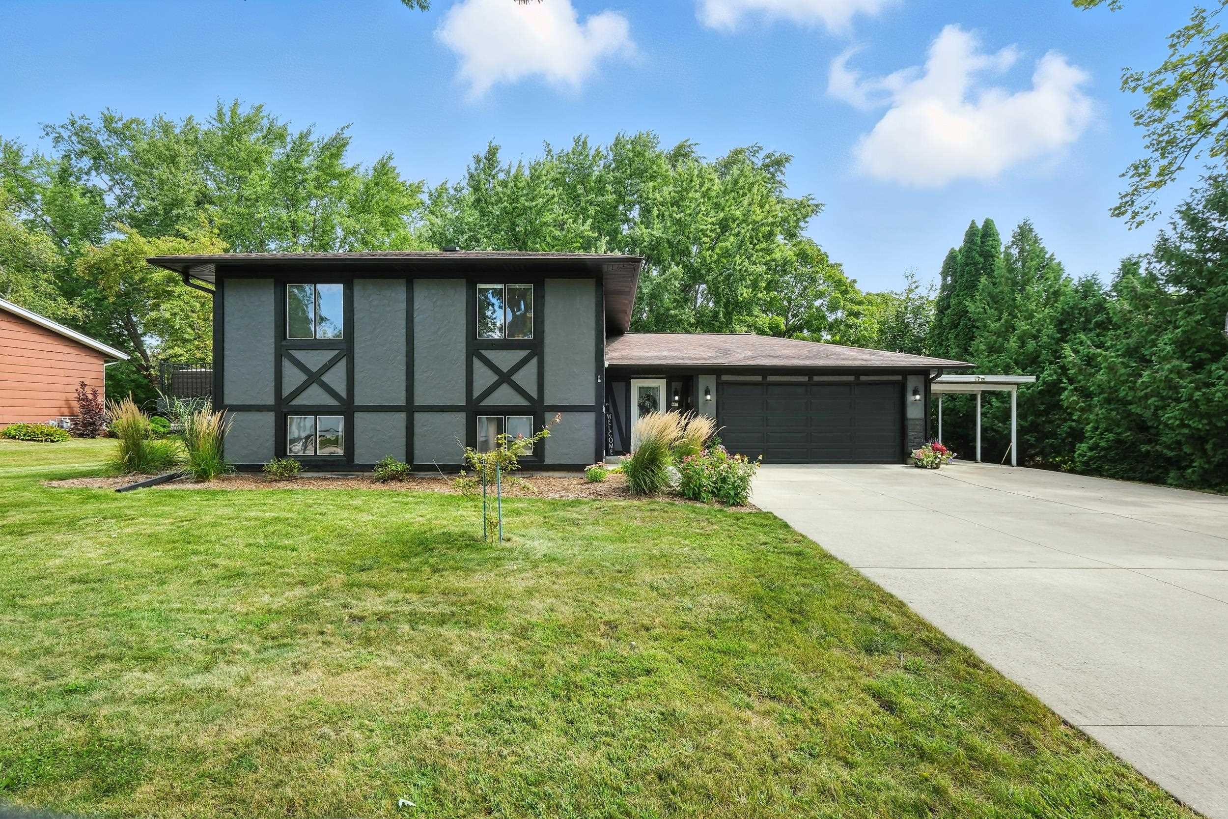 Gorgeous well-maintained home looks like it stepped right out of the pages of a magazine! Spacious 4 bed/2 bath home w/a large very pretty backyard in a wonderful, quiet neighborhood. Home has 2 complete kitchens, one on the main level & the other in the lower level, ideal setting for multi-generational living or rent out! Bright & fresh LL huge family room+ area was remodeled 2 years ago. Fun sliding "barn door". Big updated kitchen, granite countertops, SS appliances (new $1,200 dishwasher). Spacious main level laundry room w/washer & dryer incl. (could be a great future private master bathroom) Big new maintenance-free deck (2024) plus a patio. New flooring, lighting, landscaping+ Terrific floorplan! Large 2 car garage, big driveway + 3rd car carport w/extra concrete pad & 12x14 shed.