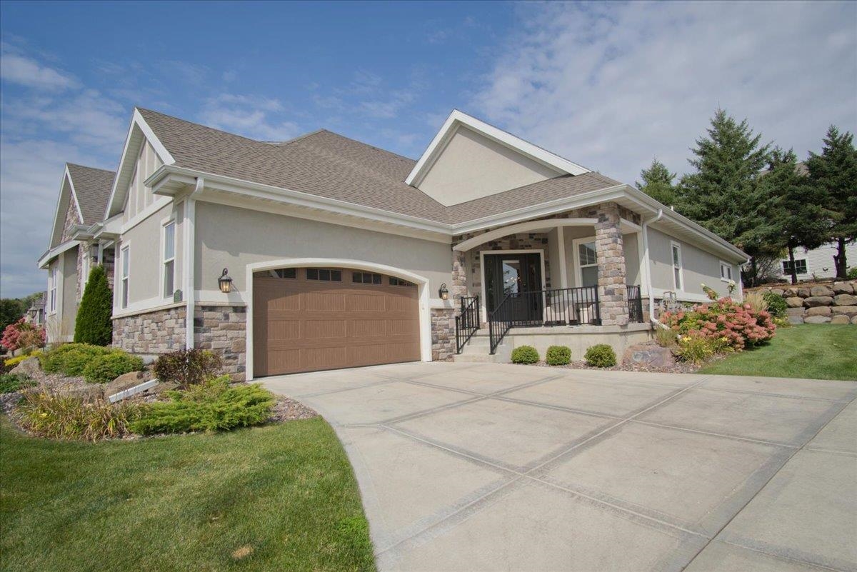 Imagine yourself here! Gorgeous ranch condo in desirable Bentley Green, minutes from Hawk's Landing Golf Course.  Custom-designed open floor plan with extra features galore. Cooking will be a dream in this show stopping kitchen featuring an oversized island, gas cooktop w/commercial hood, & a thoughtfully designed pantry. The kitchen seamlessly connects to the Great Room & Dining Area where all your friends will love to gather. Escape to the perfect retreat - luxurious primary suite with a spa-like bath, complete with enclosed 'wet room' with soaking tub & custom shower, plus a walk-in closet loaded w/built-ins. ML office, laundry room,  drop zone, & maintenance free deck add comfort & convenience.  The LL offers a spacious rec room, 2 large bedrooms, a full bath, + storage/exercise space.