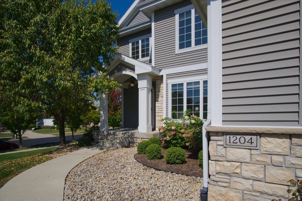Custom-built 2-story home on a private cul-de-sac in Waunakee’s desirable Southbridge neighborhood. The open main level features gorgeous hardwood floors, a gas fireplace, & a chef’s kitchen featuring a large center island, gas cooktop, & wall oven.  Entertaining is a breeze, walk out from the dining area to the comfortable screen porch, maintenance-free deck, & backyard patio with firepit. Formal dining room at entry doubles as an ideal office or flex space. Spacious primary suite offers dual vanities, jetted tub, walk-in shower, & generous closet. Finished walk-out lower level adds a rec room with wet bar, a 4th bedroom, & full bath. Enjoy the thoughtful details throughout - laundry/mudroom off the 3 car garage, ample storage, & zoned heating/cooling. Close to schools, parks, & more!