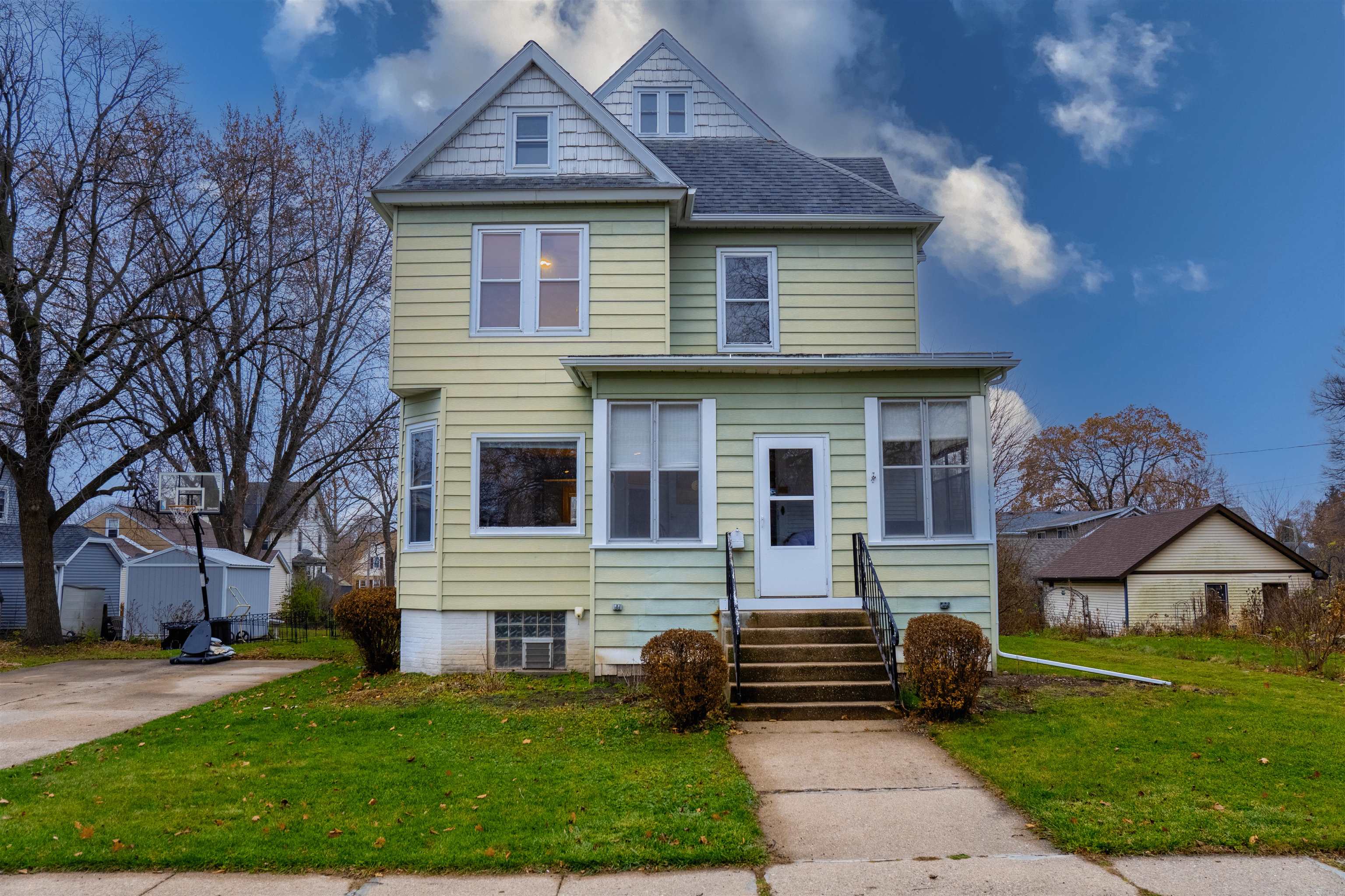 Stunning Grand Dame! Large & X tall 3-story home w/4 bedrooms upstairs & .30 acre lot. No expense was spared when this home was built. Extra tall ceilings, walk-up attic/3rd floor that is partially finished. Notice the original "dumbwaiter" which comes from the kitchen up to the attic! Bright home has 47 windows. Gorgeous ornate main staircase & second "butler" staircase to the 2nd floor. Amazing curved wall, original trim & hardwood floors-so charming! Spacious updated kitchen is bright & sunny w/lots of cabinets, countertop space & pantry. New slate appliances in 2023. Large dining room, living room & family room/formal dining room. Cozy wood burning fireplace. Main level updated bath is large & could be main level laundry, add a full shower if desired too. King size primary bedroom w/do